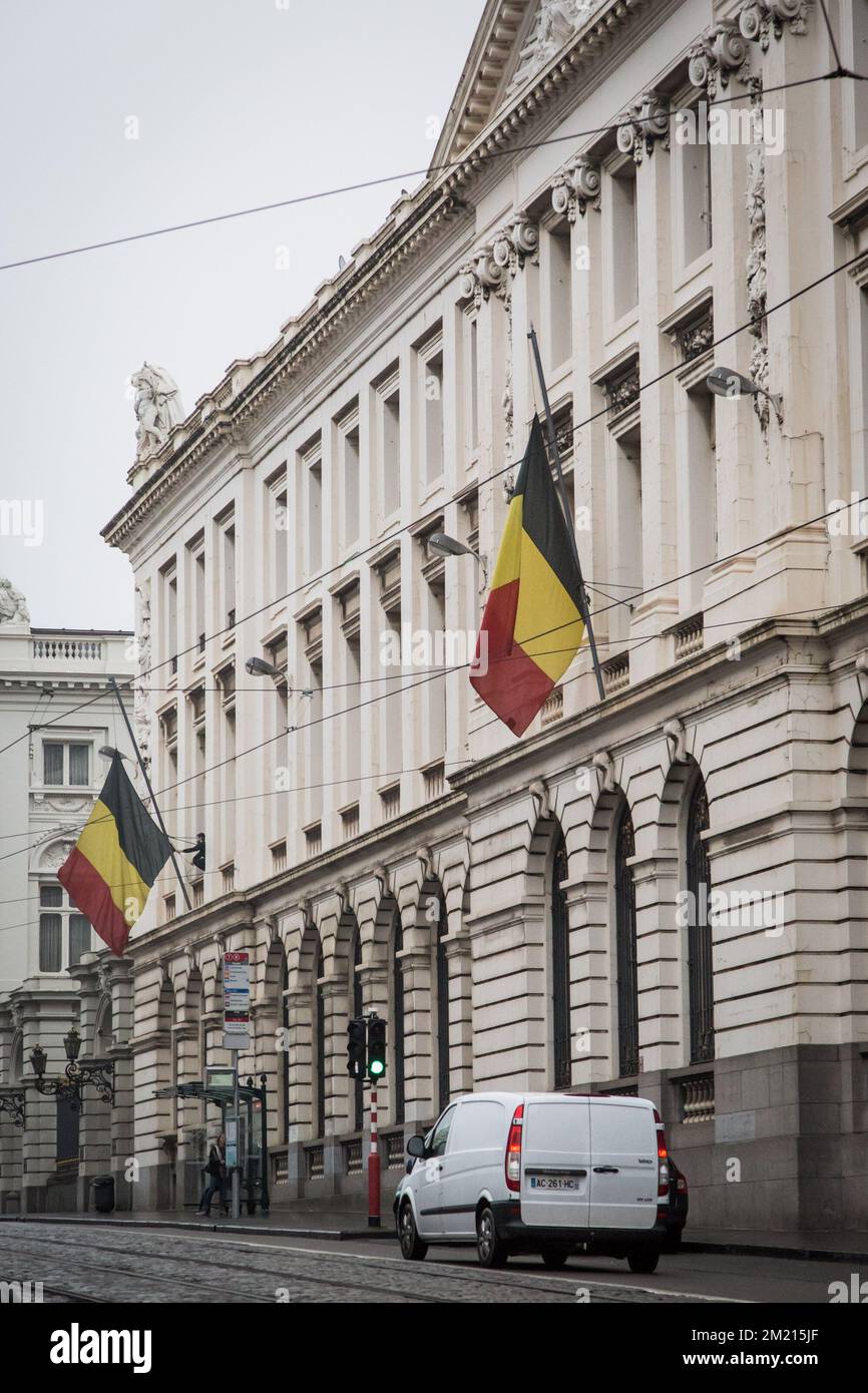 Illustration picture shows a Belgian flag at half-staff in Brussels, Wednesday 23 March 2016. Yesterday morning two bombs exploded in the departure hall of Brussels Airport and another one in the Maelbeek - Maalbeek subway station, which made around 30 deadly victims and 230 injured people in total. Stock Photo