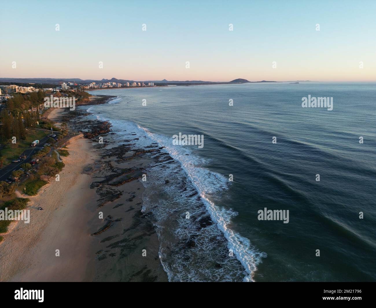 An aerial view of ocean waves with foam on a beach Stock Photo - Alamy