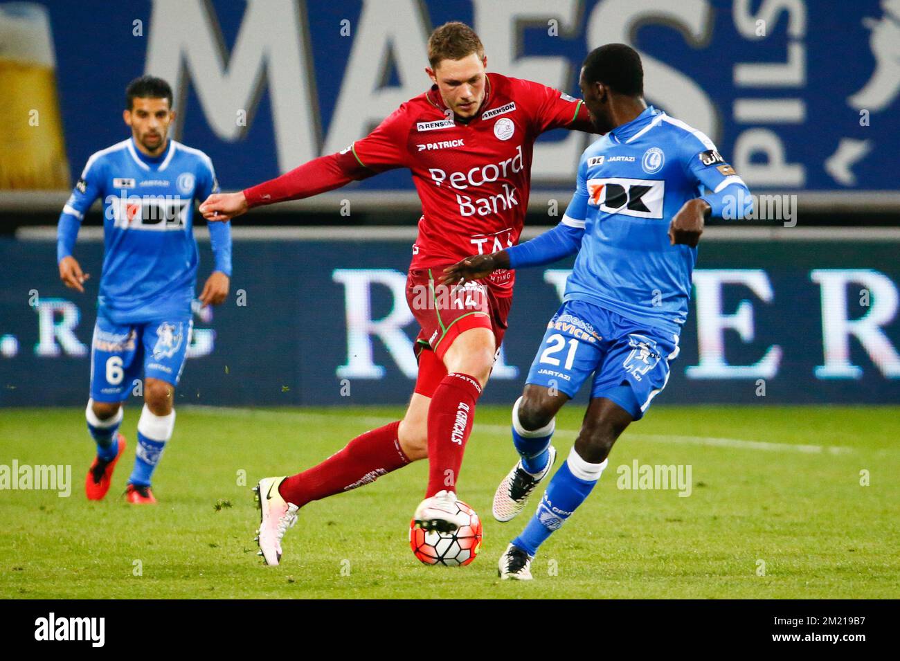 Essevee's Henrik Dalsgaard and Gent's Nana Asare fight for the ball during the Jupiler Pro League match between KAA Gent and Zulte Waregem, in Gent, Friday 01 April 2016, on day 1 of the Play-off 1 of the Belgian soccer championship.  Stock Photo