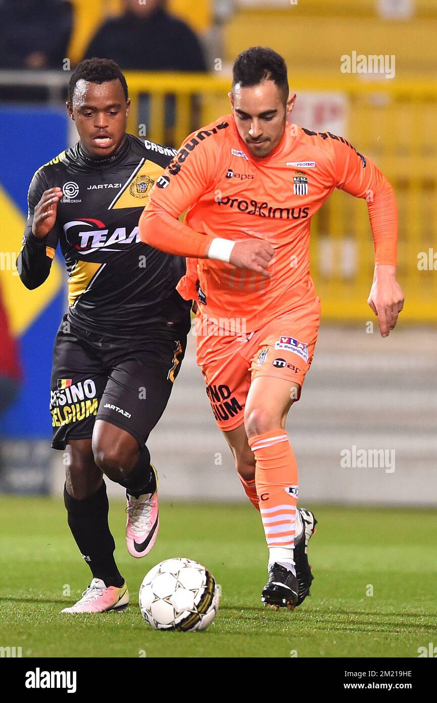 Charleroi's Stergos Marinos and Lokeren's Ayanda Patosi fight for the ball during the Jupiler Pro League match between Lokeren and Charleroi, in Lokeren, Saturday 02 April 2016, on day 1 of the Play-off 2B of the Belgian soccer championship. Stock Photo
