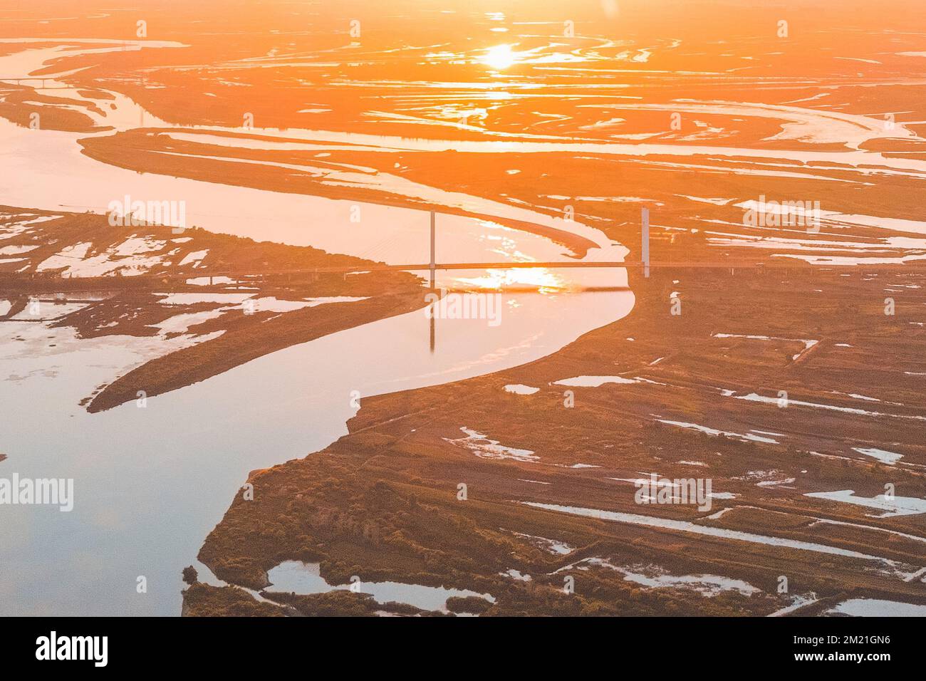 An aerial view of a river at sunset Stock Photo - Alamy