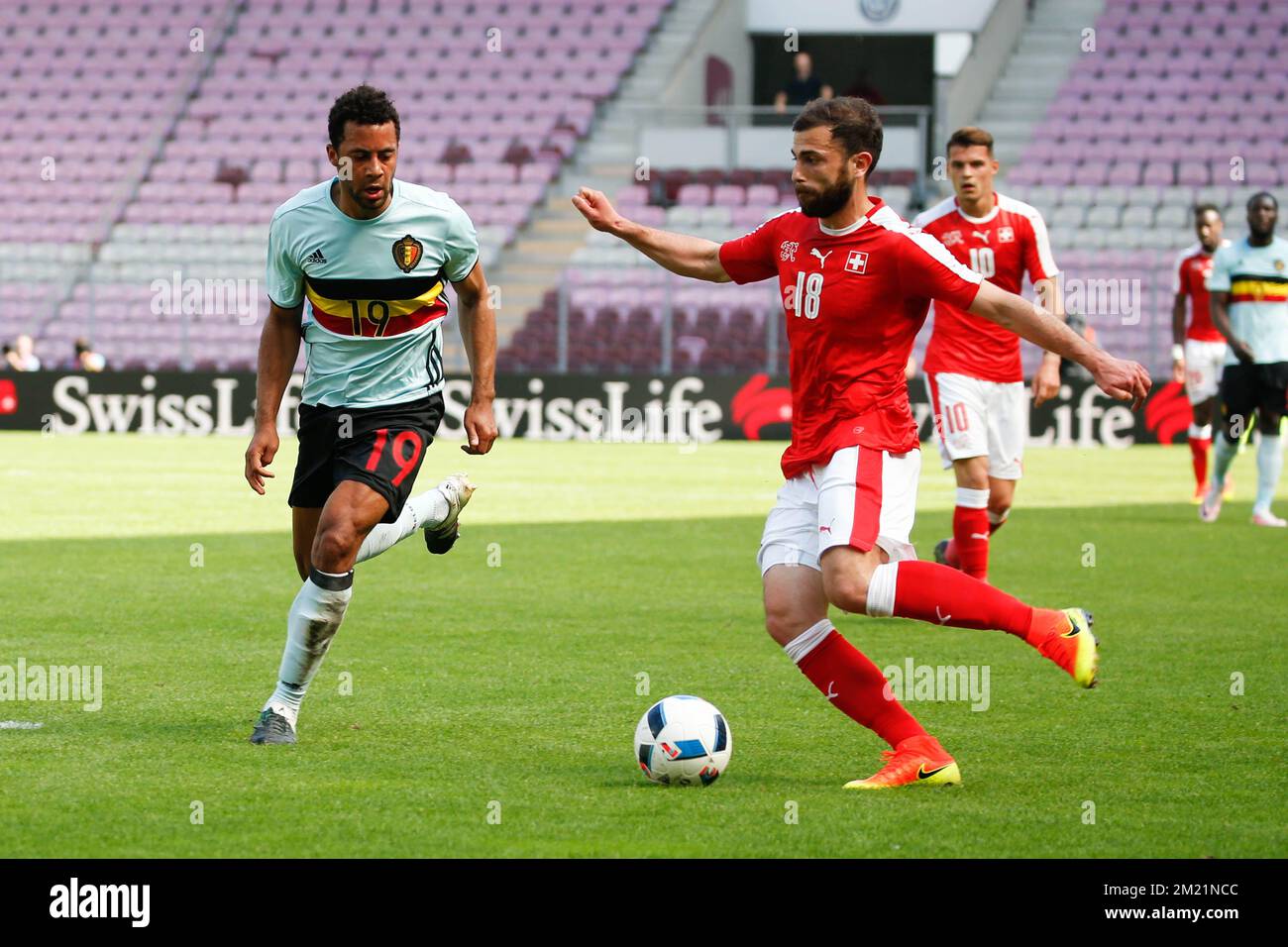 Belgium's Mousa Dembele and Switzerland's Admir Mehmedi fight for the ball during a friendly soccer game between the Swiss national team and the Belgian national soccer team Red Devils, after a training camp, on Saturday 28 May 2016, in Geneve, Switzerland. The team is preparing for the upcoming Euro 2016 UEFA European Championship in France.  Stock Photo