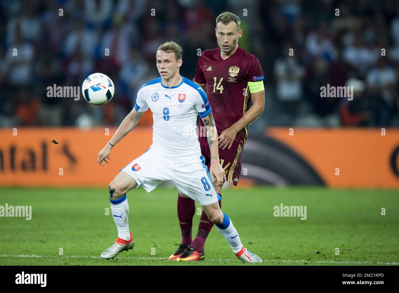 Ondrej Duda and Vasili Berezutski fights for the ball during a soccer game between Russian national soccer team Slovakia, in group B of the group stage of the UEFA Euro 2016 European Championships, Wednesday 15 June 2016 in Lille, France in Gent. Wednesday 15 June 2016  BELGA PHOTO JASPER JACOBS Stock Photo