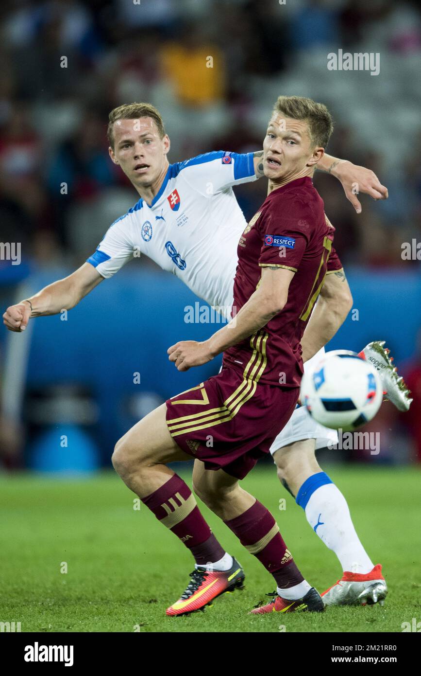Ondrej Duda and Oleg Shatov fight for the ball during a soccer game between Russian national soccer team Slovakia, in group B of the group stage of the UEFA Euro 2016 European Championships, Wednesday 15 June 2016 in Lille, France in Gent. Wednesday 15 June 2016  BELGA PHOTO JASPER JACOBS Stock Photo