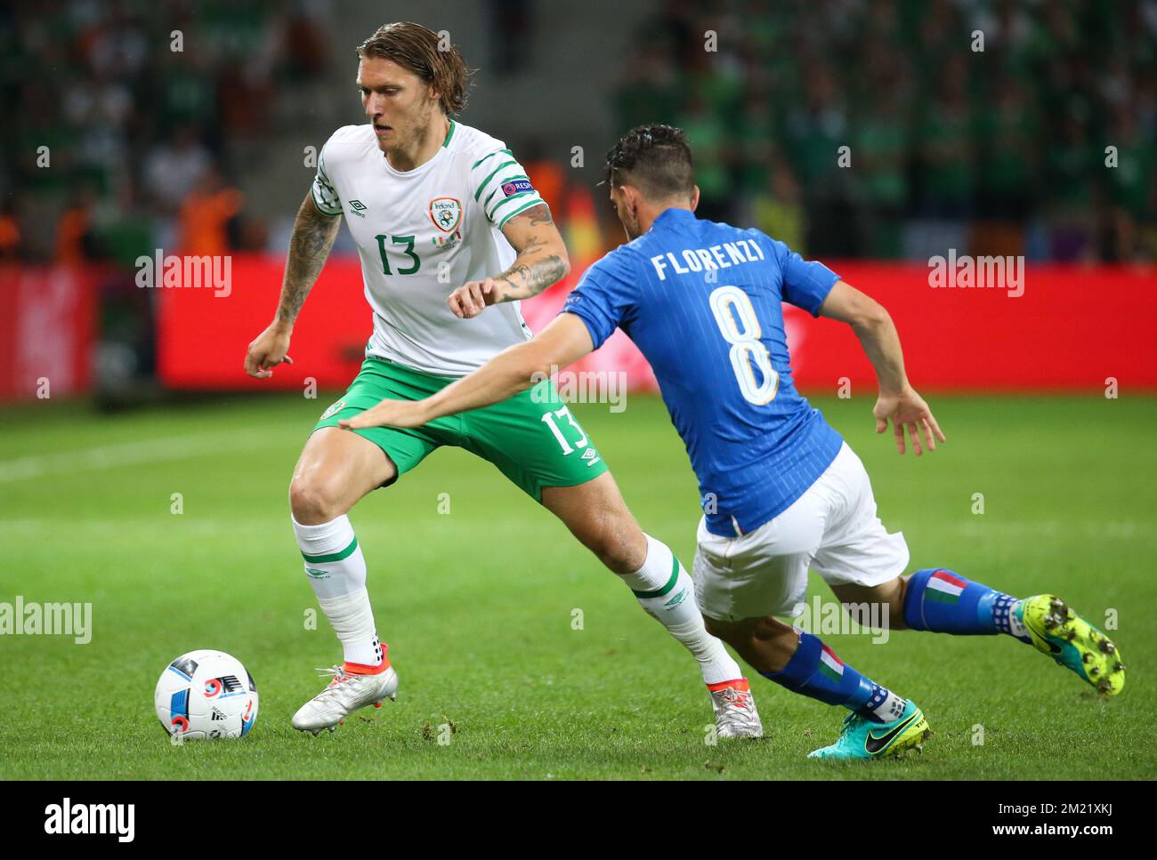 Ireland's Jeff Hendrick and Italy's Alessandro Florenzi fight for the ball during a soccer game between Ireland and Italy, in group E of the group stage of the UEFA Euro 2016 European Championships, Wednesday 22 June 2016 in Villeneuve-d'Ascq, France.  Stock Photo