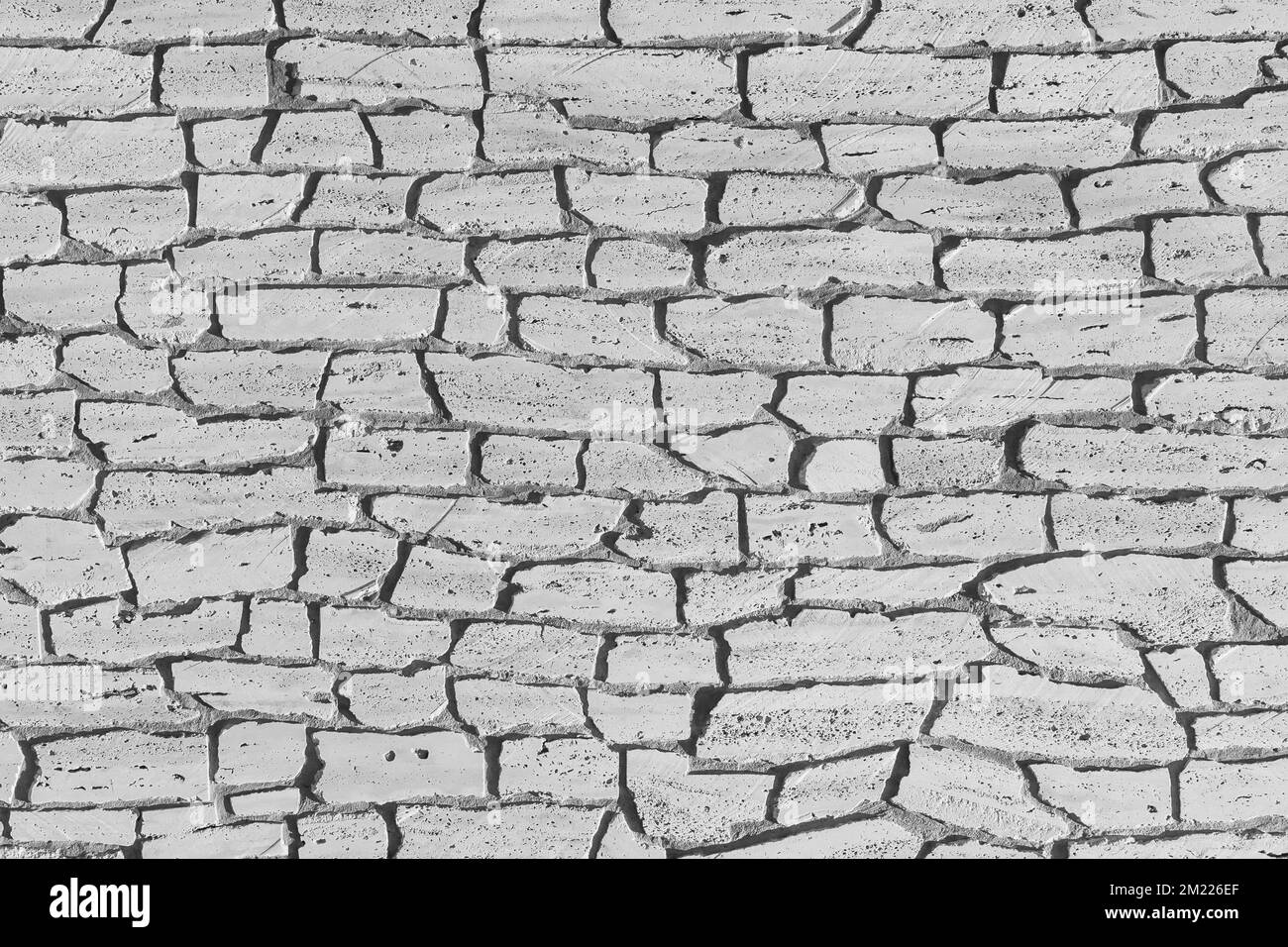 Light white grey stone brick wall, modern texture masonry pattern