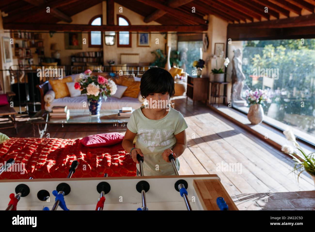 Upper view on girl playing table football Stock Photo - Alamy