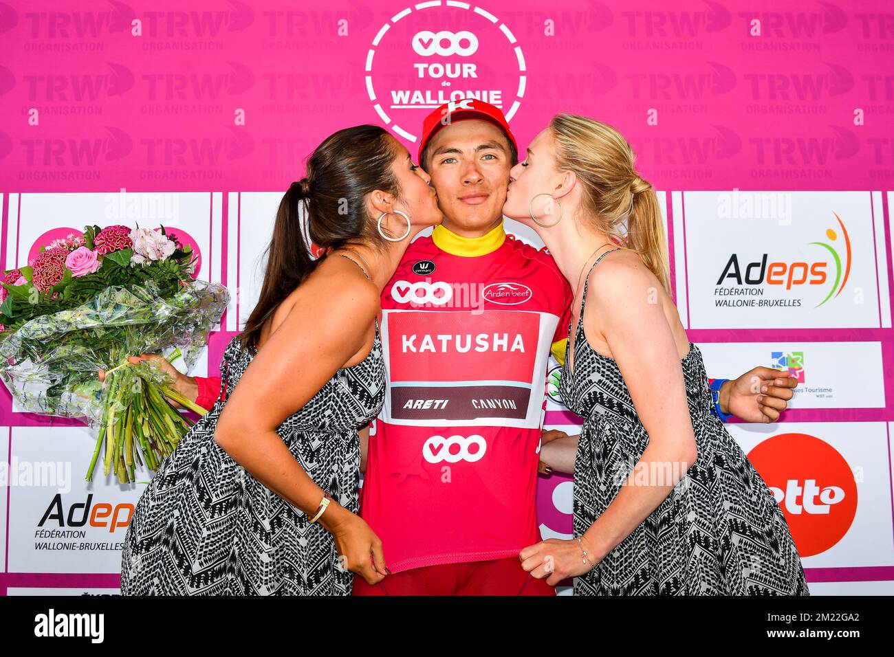 Russian Viacheslav Kuznetsov of Team Katusha celebrates on the podium with the fuchsia jersey after the fifth and last stage of the Tour De Wallonie cycling race 183.9km from Engis to Dison