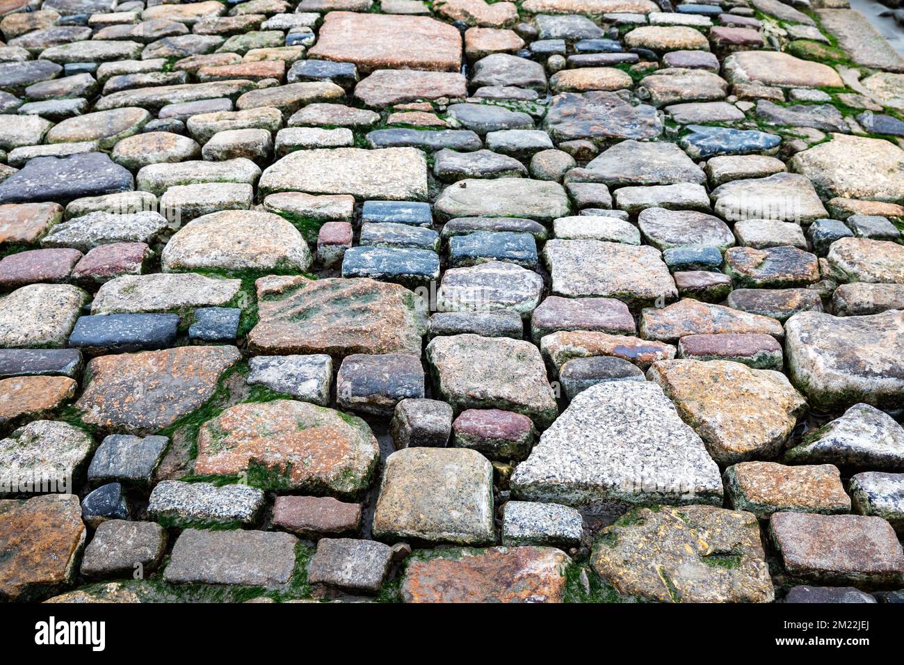 Coloured rocks on the causeway to and from Saint Michael's Mount in ...