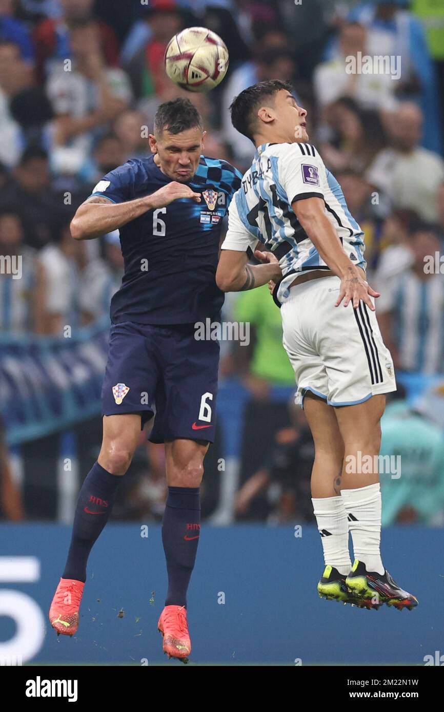 Lusail, Qatar. 13th Dec, 2022. Dejan Lovren (L) of Croatia vies with Paulo Dybala of Argentina during the Semifinal between Argentina and Croatia at the 2022 FIFA World Cup at Lusail Stadium in Lusail, Qatar, Dec. 13, 2022. Credit: Xu Zijian/Xinhua/Alamy Live News Stock Photo