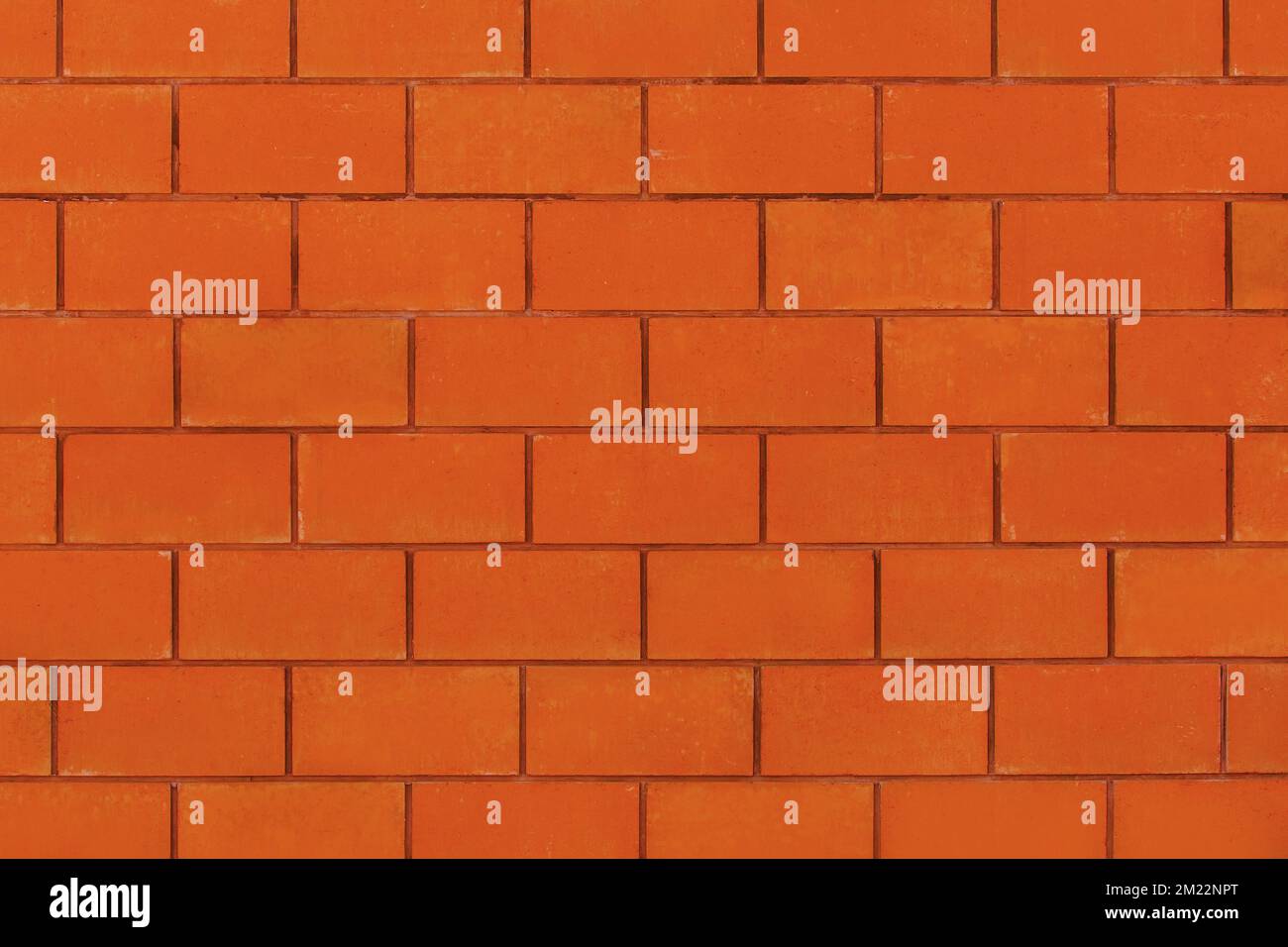 Orange-brown paint on brick blocks urban design wall texture pattern background architecture stone abstract. Stock Photo