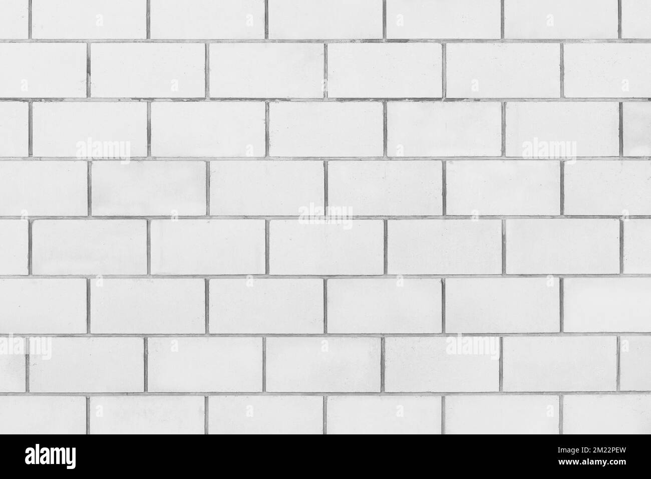 Light white paint on brick blocks urban design wall texture pattern