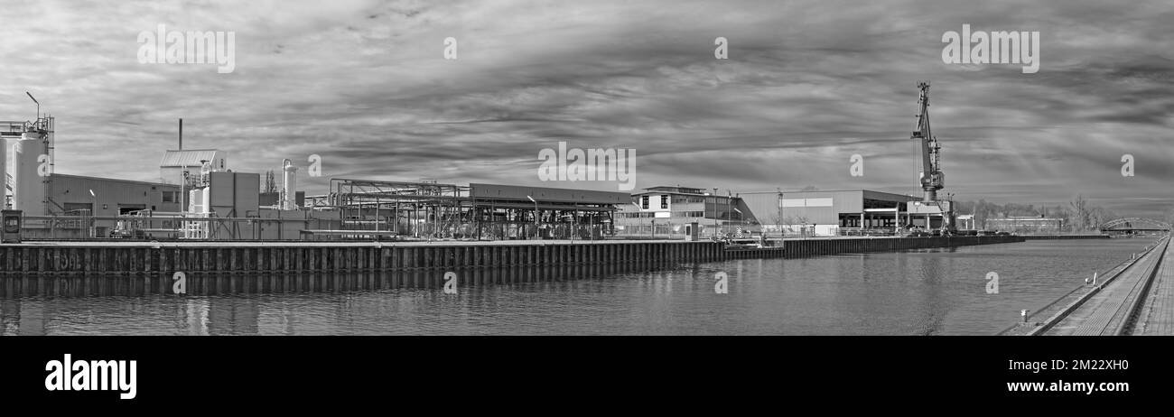 HQ Panorama - Port facility with industry and inland shipping cargo crane in Hanover, Germany Stock Photo