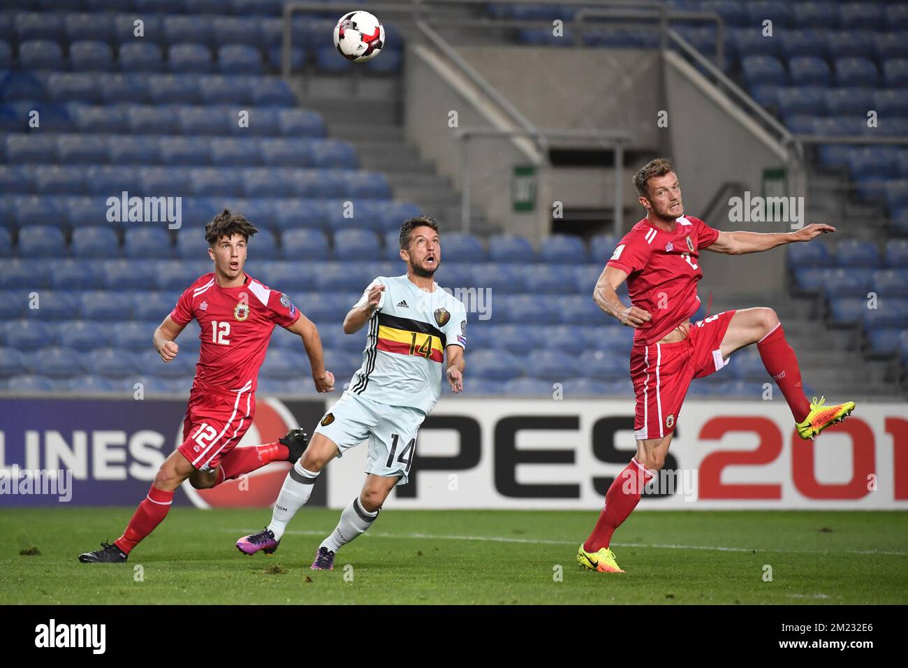 Gibraltar's Jayce Mascarenhas-Olivero, Belgium's Dries Mertens and Gibraltar's Scott Wiseman fight for the ball during a World Cup 2018 qualification game between Belgian national soccer team Red Devils and Gibraltar, Monday 10 October 2016 in Almancil, Portugal. BELGA PHOTO DIRK WAEM Stock Photo
