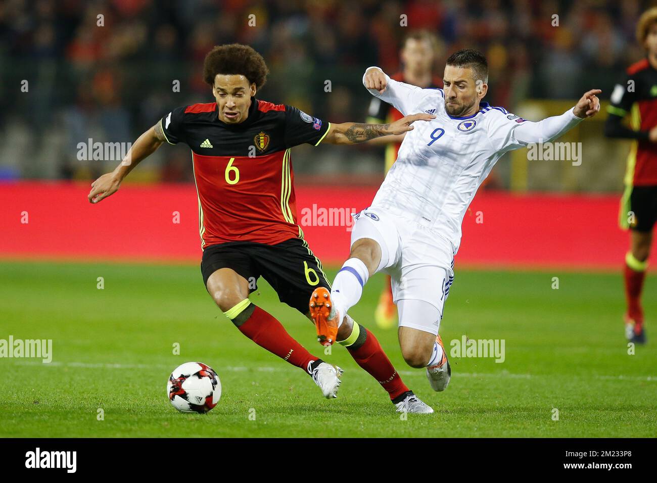Belgium's Axel Witsel and Bosnia's Vedad Ibisevic fight for the ball during a soccer match between Belgium's Red Devils and Bosnia and Herzegovina, the second World Championships 2018 Qualification game in Group H, on Friday 07 October 2016, in Brussels. BELGA PHOTO BRUNO FAHY Stock Photo