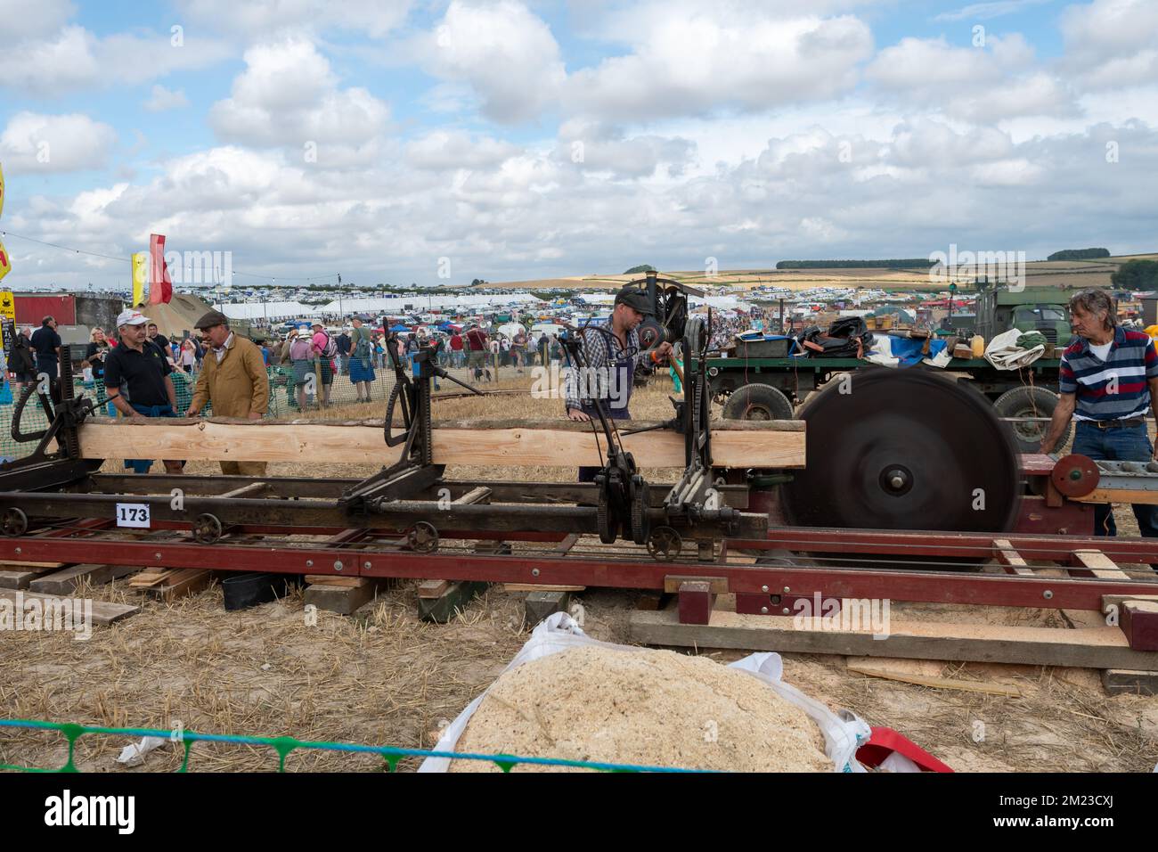 Tarrant Hinton.Dorset.United Kingdom.August 25th 2022.Enthusiasts are cutting planks of wood with an old fashioned circular saw at the Great Dorset St Stock Photo
