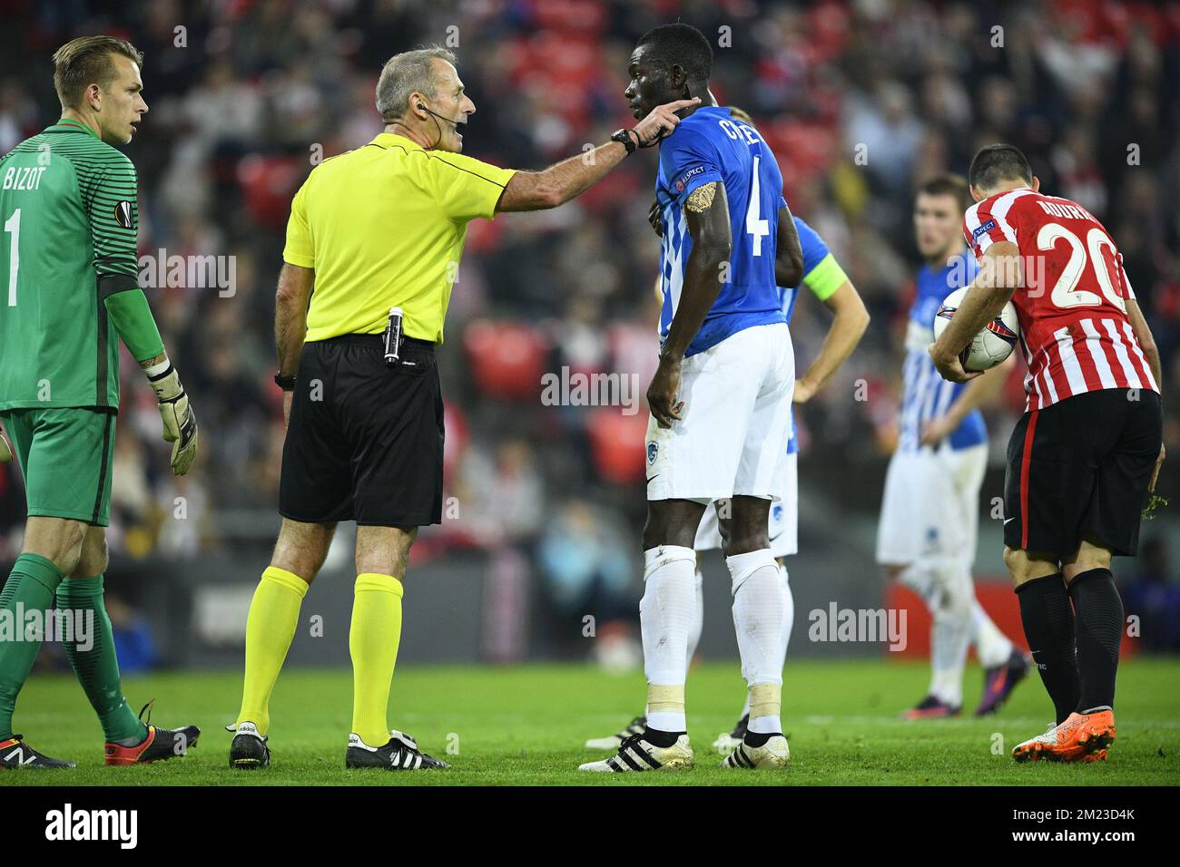 Genk's goalkeeper Marco Bizot, Referee Martin Atkinson, Genk's Omar Colley and Athletic's forward Aritz Aduriz pictured during a soccer game between Spanish Club Athletic Bilbao and Belgian team KRC Genk in Bilbao, Spain, Thursday 03 November 2016, the fourth game of the group stage of the Europa League competition in Group F. BELGA PHOTO YORICK JANSENS Stock Photo