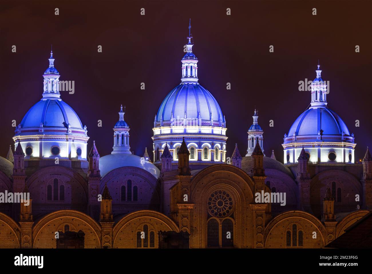 Three illuminated domes of the New Cathedral, Cuenca, Ecuador. Stock Photo