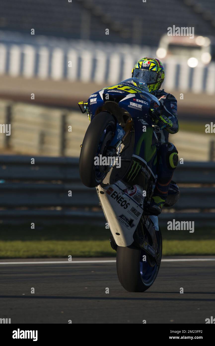 Download Valentino Rossi Perfecting a Signature Wheelie Stunt Wallpaper