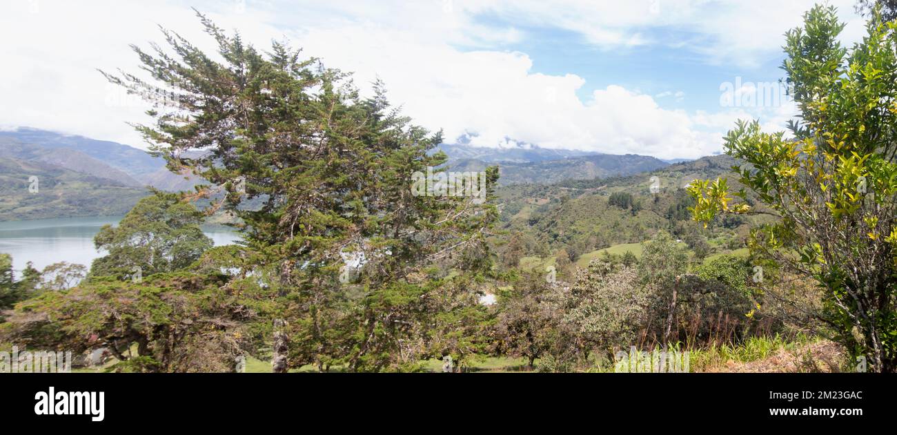 Colombian mountain landscape with lake and blue cloudy sky Stock Photo ...