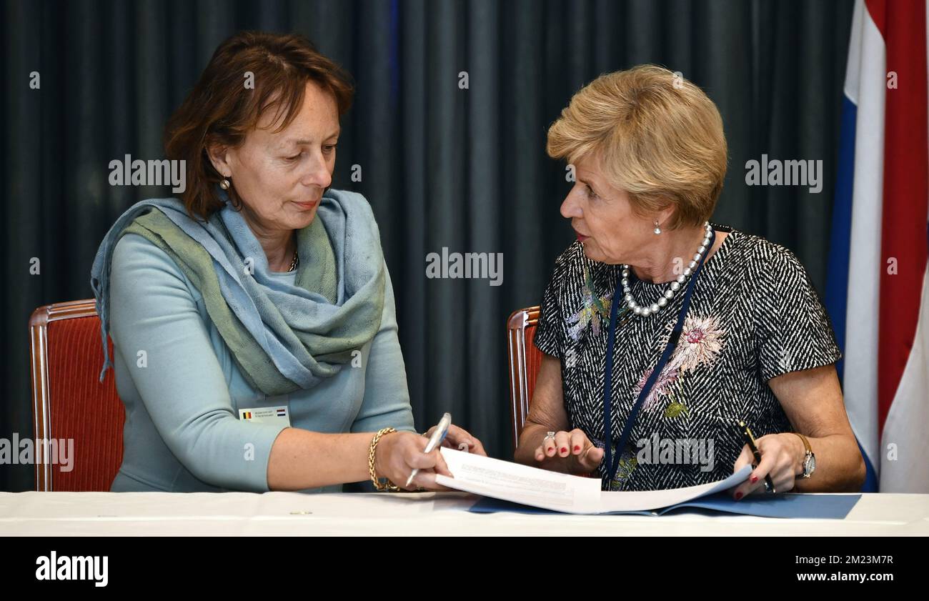 UGent (Ghent University) Anne De Paepe and Evides Industriewater Anette Ottolini pictured at a signing ceremony with several belgian and Dutch companies on the first day of a three days State visit of Belgian royal couple in The Netherlands, in Amsterdam, Monday 28 November 2016. BELGA PHOTO ERIC LALMAND Stock Photo