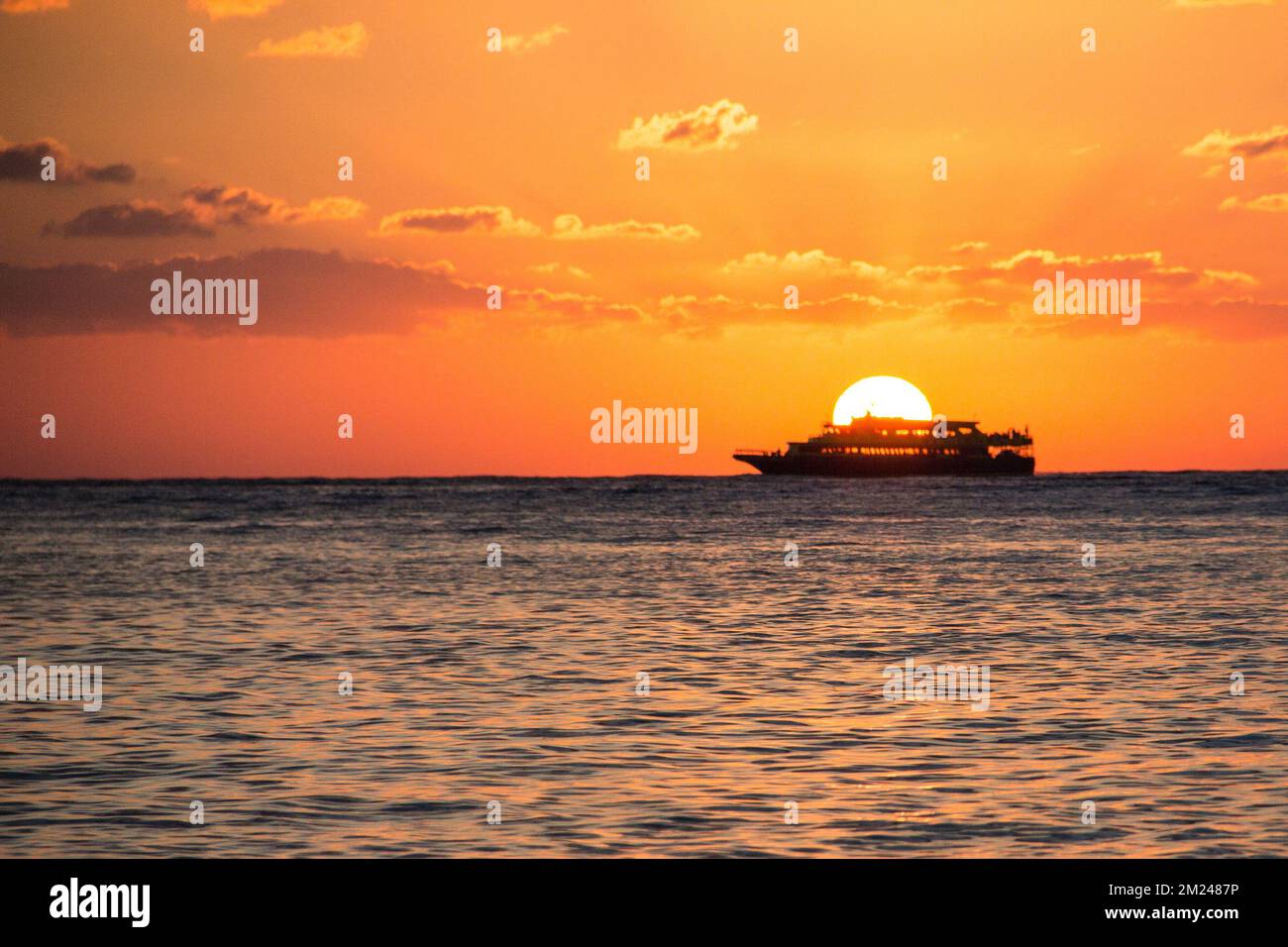 A silhouette of the boat in the sea on a sunset Stock Photo - Alamy