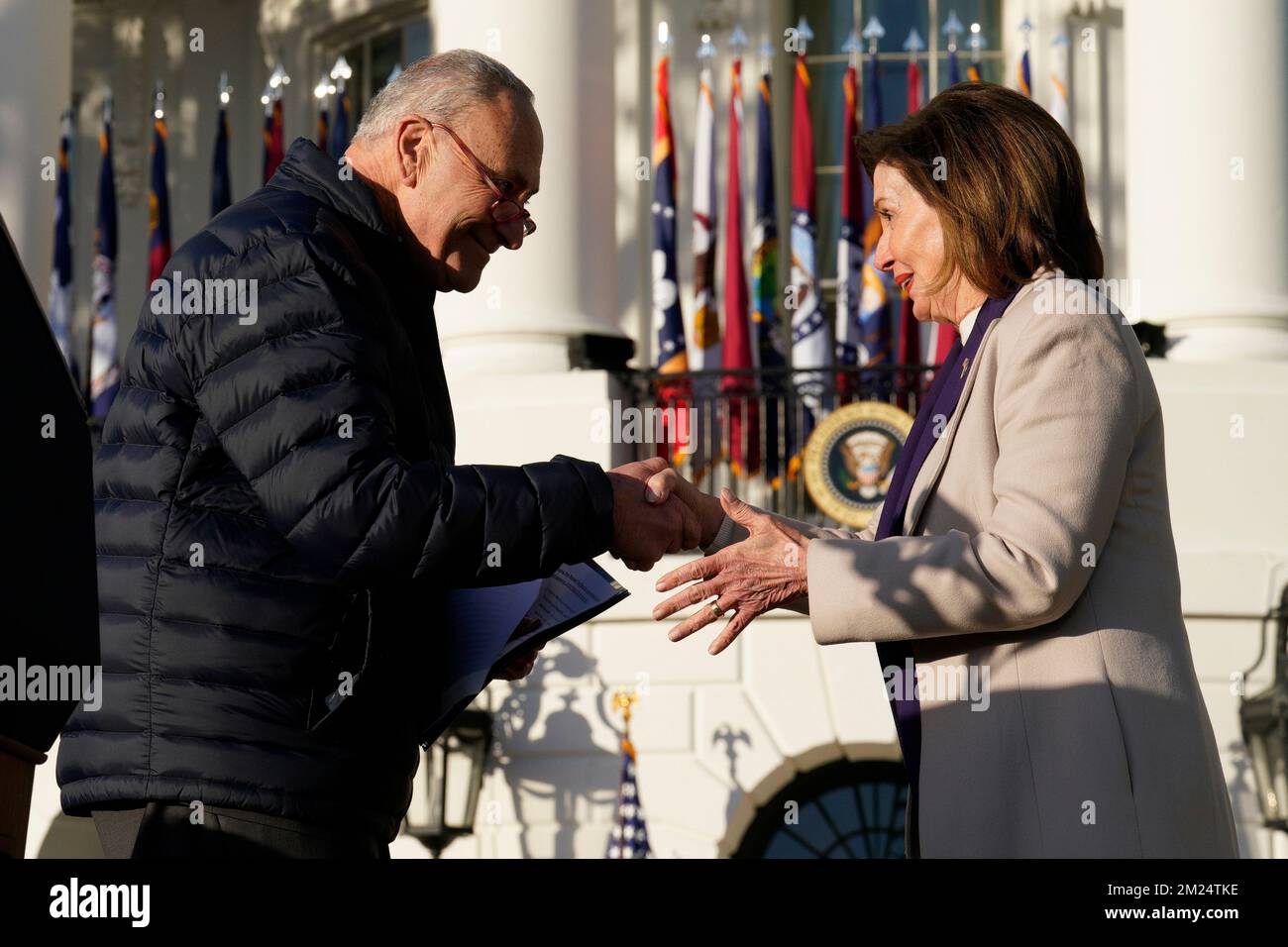 Washington, USA. 13th Dec, 2022. U.S. House Speaker Nancy Pelosi (D-CA) and Senate Majority Leader Chuck Schumer (D-NY) participate in a ceremony with President Joe Biden to sign the Respect for Marriage Acton the South Lawn of the White House in Washington on December 13, 2022. Photo by Yuri Gripas/Pool/Sipa USA Credit: Sipa USA/Alamy Live News Stock Photo