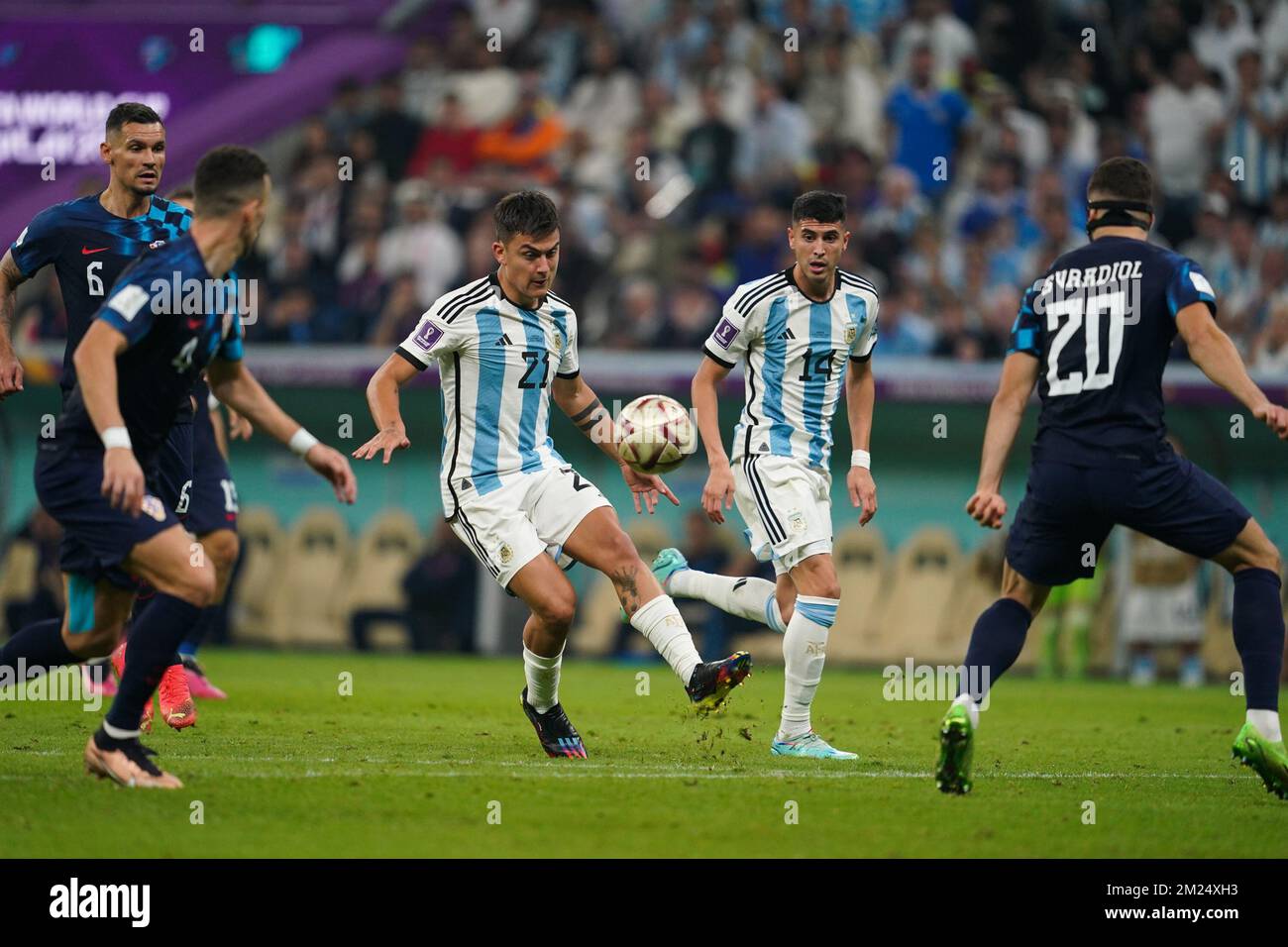 DOHA, QATAR - DECEMBER 13: Player of Argentina Paulo Dybala passes the ball during the FIFA World Cup Qatar 2022 Semi-finals match between Argentina and Croatia at Lusail Stadium on December 13, 2022 in Lusail, Qatar. (Photo by Florencia Tan Jun/PxImages) Stock Photo