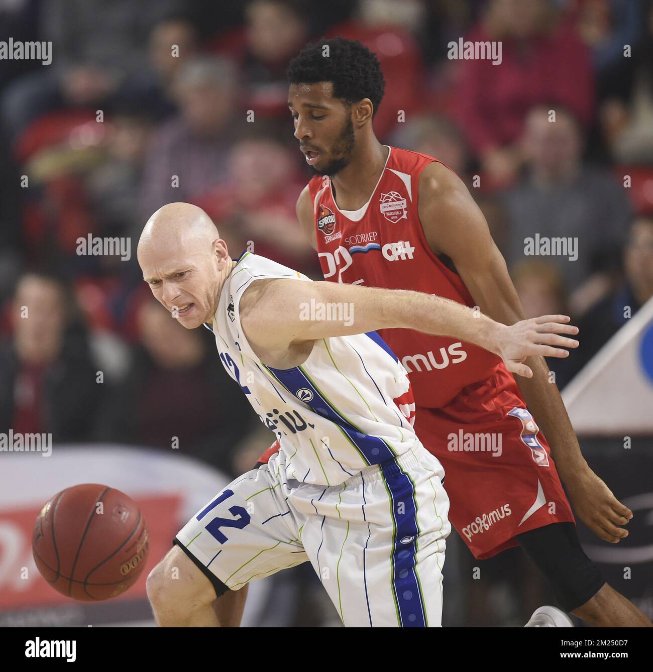 Mons' Lionel Bosco and Charleroi's Loic Schwartz fight for the ball during  the basketball game between Spirou Charleroi and Belfius Mons-Hainaut, the  18th match day of the EuroMillions League basket competition, on