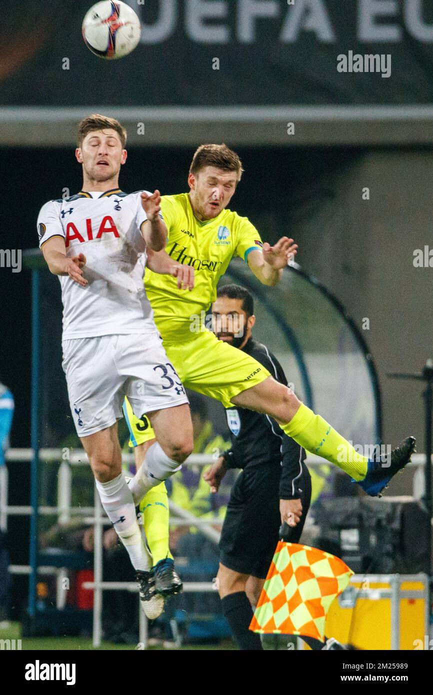 Tottenham's defender Ben Davies and Gent's Thomas Foket fight for the ball during a game between Belgian soccer team KAA Gent and British team Tottenham, first-leg of the 1/16 finals of the Europa League competition, Thursday 16 February 2017, in Gent. BELGA PHOTO KURT DESPLENTER Stock Photo