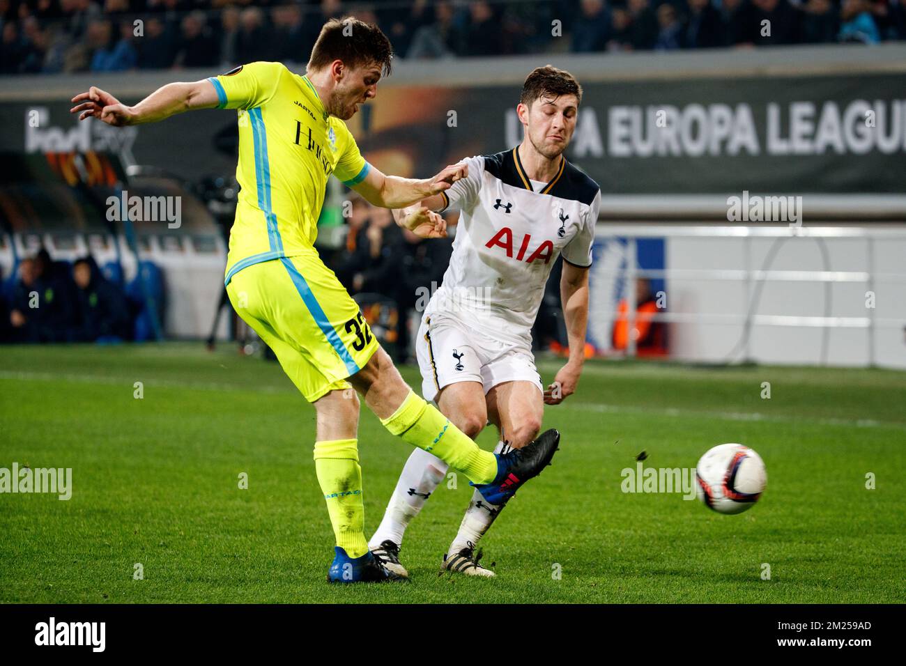 Gent's Thomas Foket and Tottenham's defender Ben Davies fight for the ball during a game between Belgian soccer team KAA Gent and British team Tottenham, first-leg of the 1/16 finals of the Europa League competition, Thursday 16 February 2017, in Gent. BELGA PHOTO KURT DESPLENTER Stock Photo
