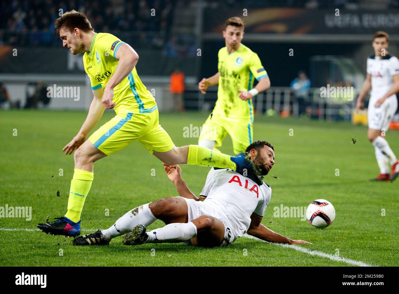 Gent's Thomas Foket and Tottenham's midfielder Mousa Dembele fight for the ball during a game between Belgian soccer team KAA Gent and British team Tottenham, first-leg of the 1/16 finals of the Europa League competition, Thursday 16 February 2017, in Gent. BELGA PHOTO KURT DESPLENTER Stock Photo