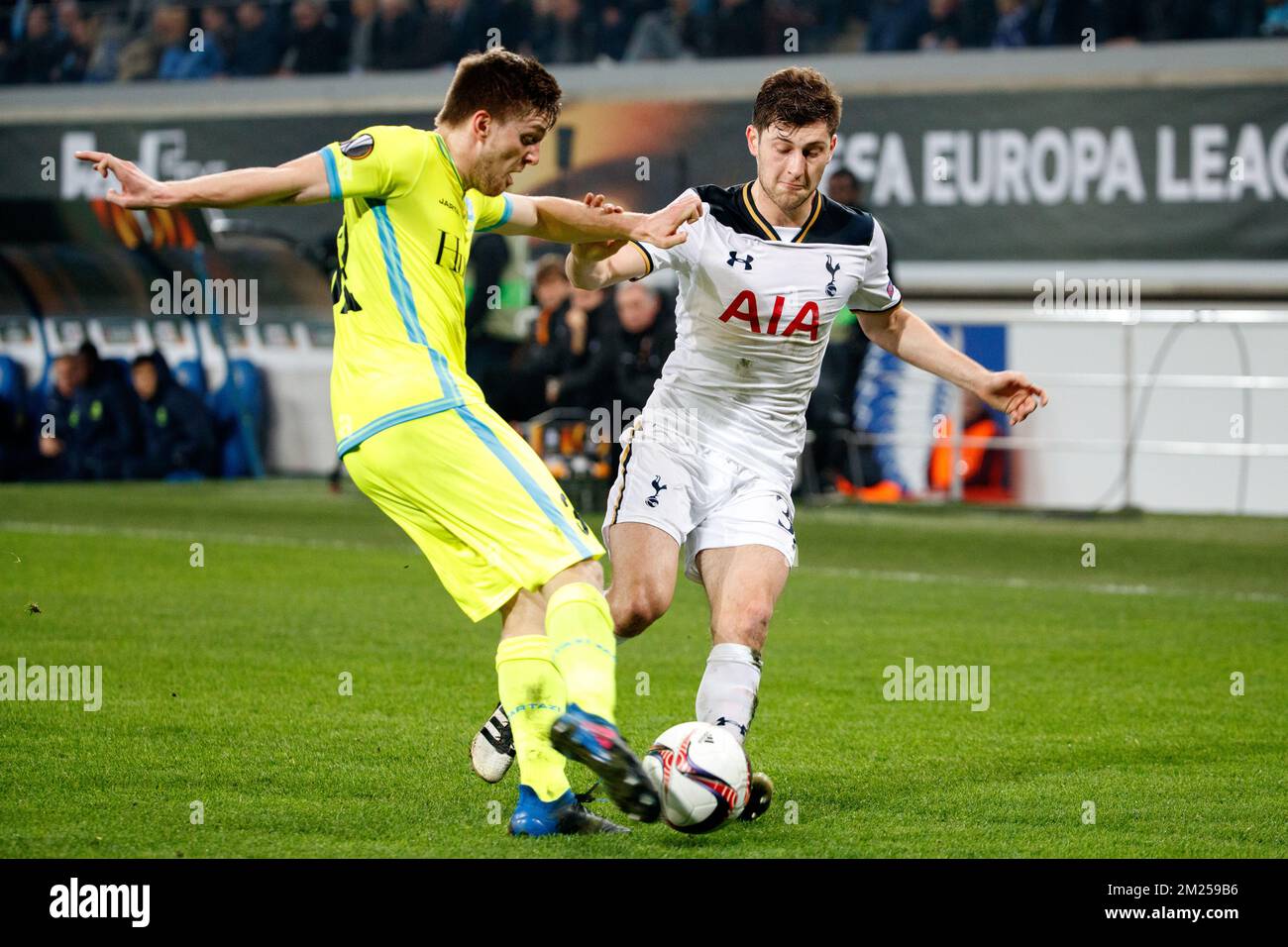 Gent's Thomas Foket and Tottenham's defender Ben Davies fight for the ball during a game between Belgian soccer team KAA Gent and British team Tottenham, first-leg of the 1/16 finals of the Europa League competition, Thursday 16 February 2017, in Gent. BELGA PHOTO KURT DESPLENTER Stock Photo