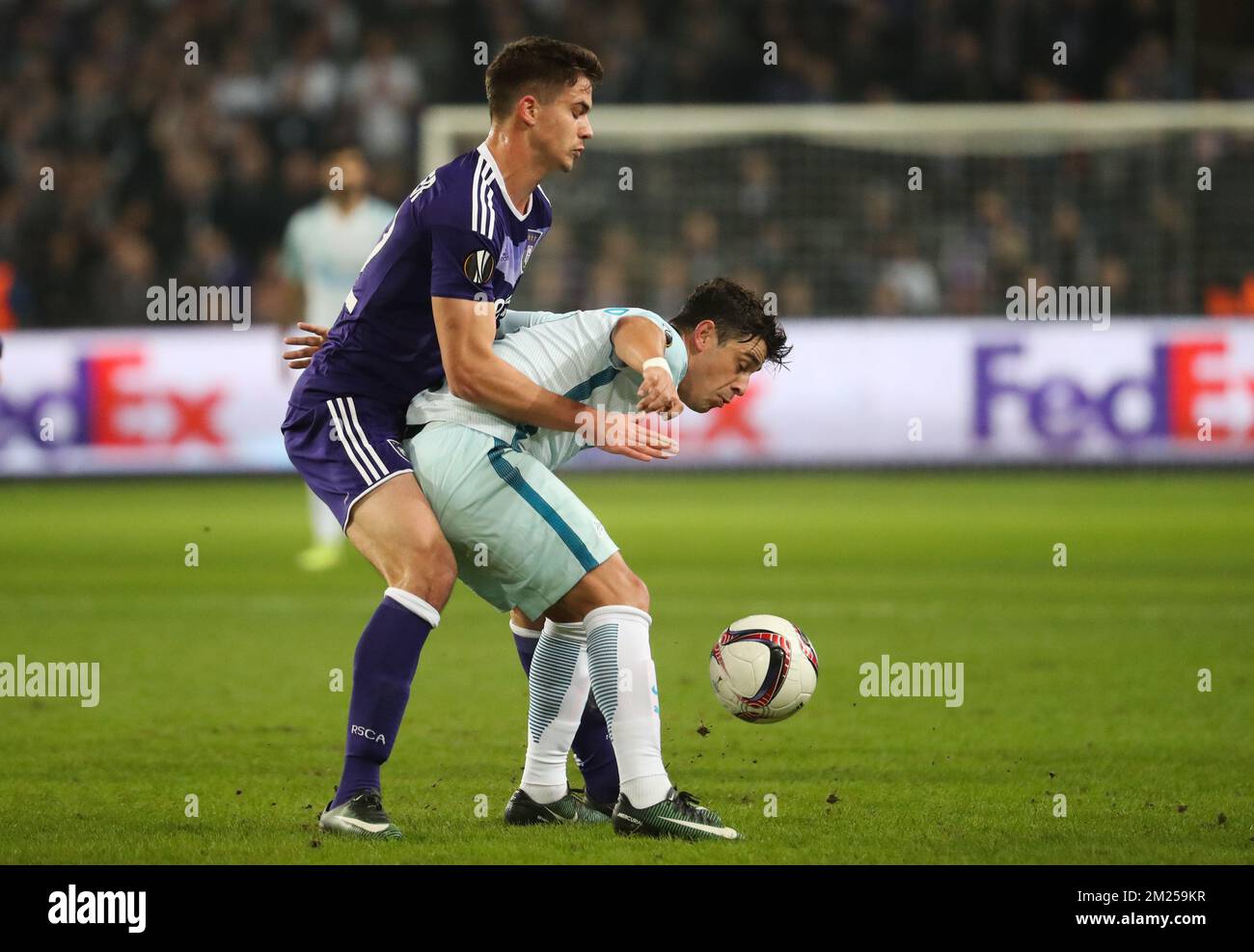 Anderlecht's Leander Dendoncker and Zenit's midfielder's Yuri Zhirkov fight for the ball during a game between Belgian soccer team RSC Anderlecht and Russian team FC Zenit, first-leg of the 1/16 finals of the Europa League competition, Thursday 16 February 2017, in Brussels. BELGA PHOTO VIRGINIE LEFOUR Stock Photo