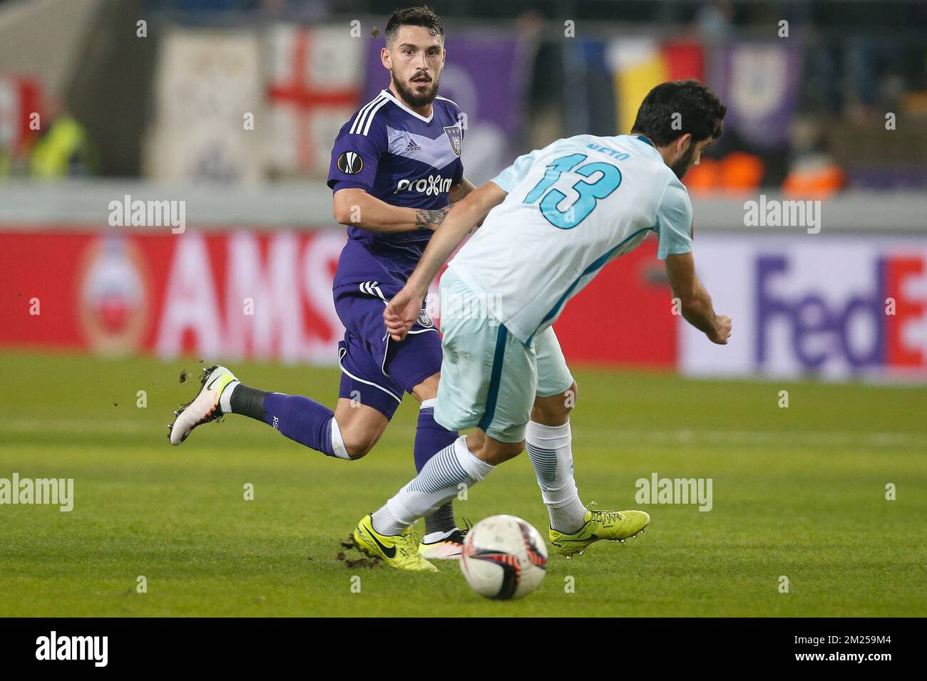 Anderlecht's Nicolae-Claudiu Stanciu and Zenit's defender Luis Neto fight for the ball during a game between Belgian soccer team RSC Anderlecht and Russian team FC Zenit, first-leg of the 1/16 finals of the Europa League competition, Thursday 16 February 2017, in Brussels. BELGA PHOTO BRUNO FAHY Stock Photo