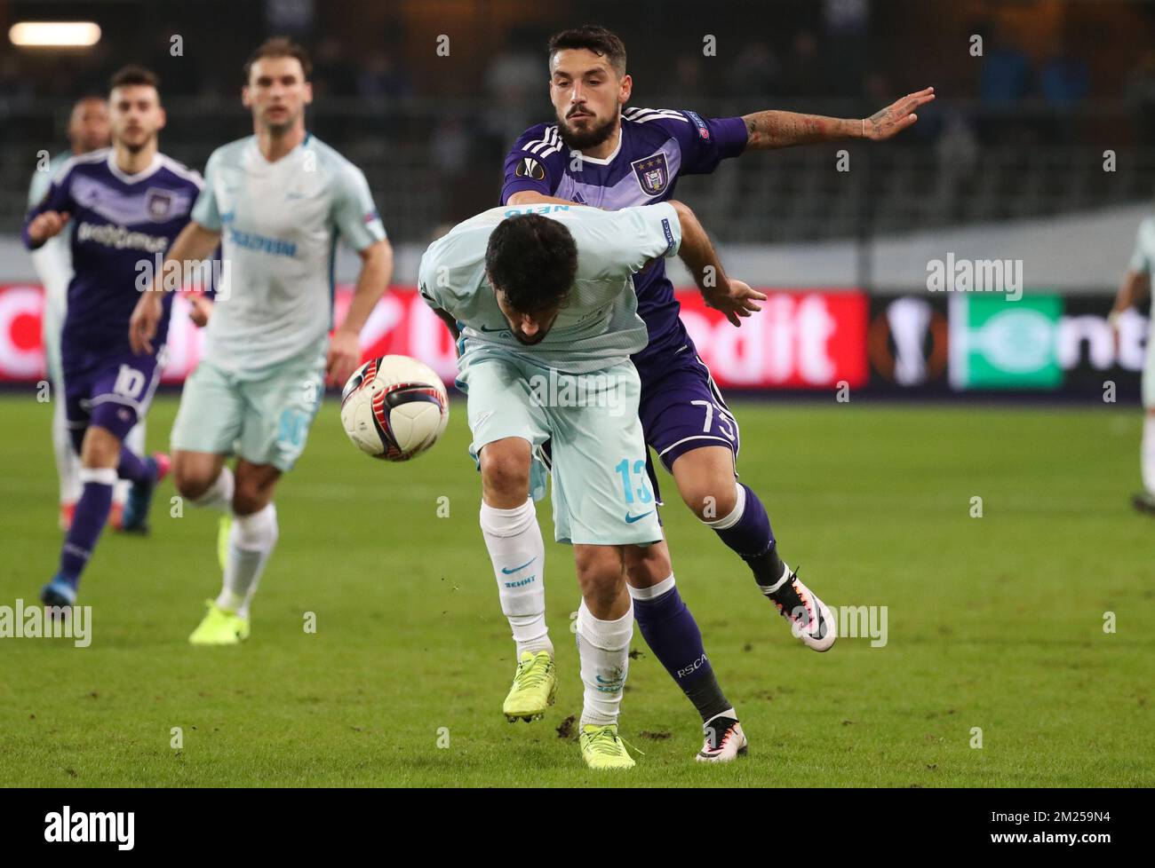 Zenit's defender Luis Neto and Anderlecht's Nicolae-Claudiu Stanciu fight for the ball during a game between Belgian soccer team RSC Anderlecht and Russian team FC Zenit, first-leg of the 1/16 finals of the Europa League competition, Thursday 16 February 2017, in Brussels. BELGA PHOTO VIRGINIE LEFOUR Stock Photo