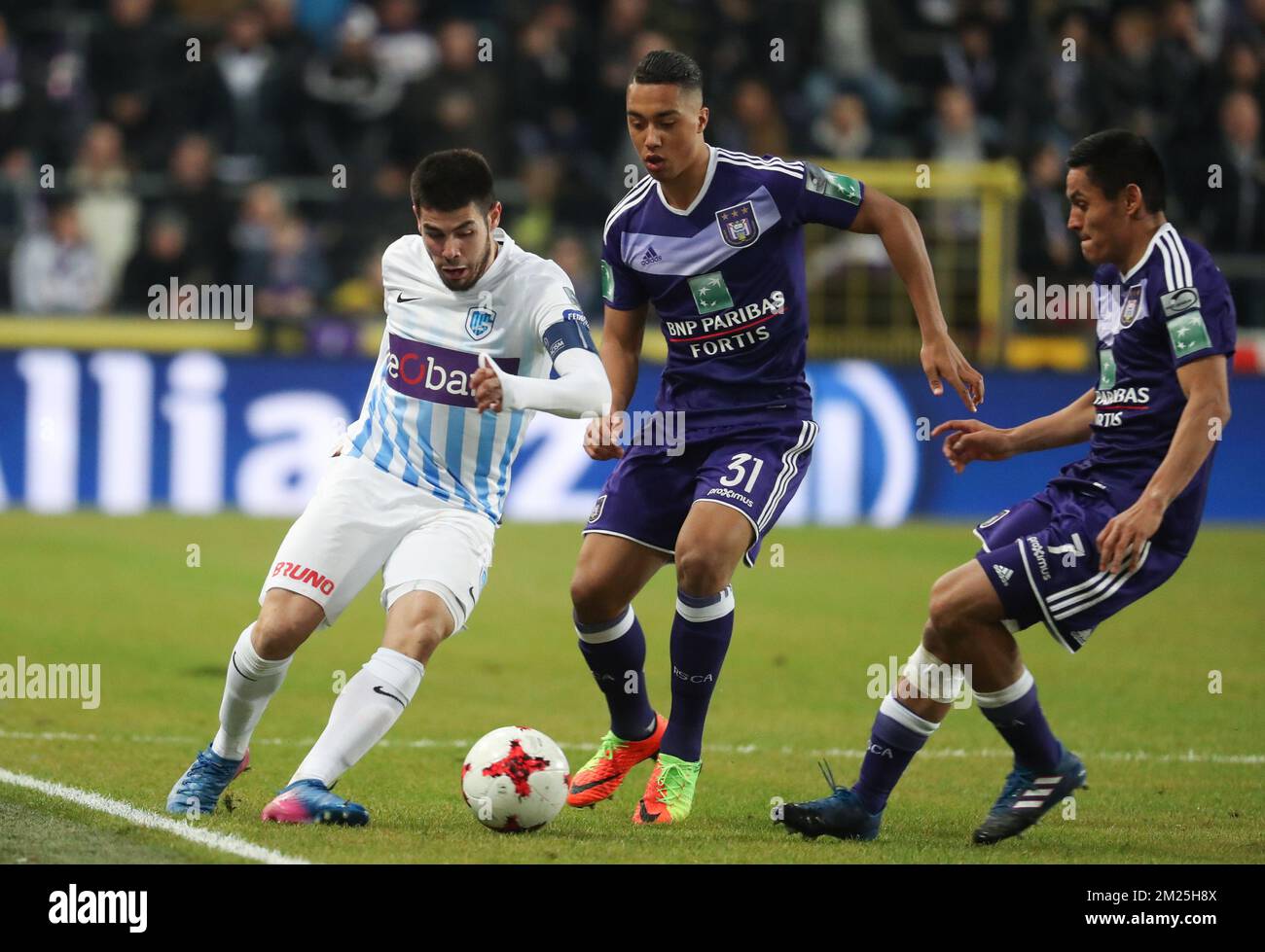 Genk's Alejandro Pozuelo, Anderlecht's Youri Tielemans and Anderlecht's Andy Najar fight for the ball during the Jupiler Pro League match between RSC Anderlecht and KRC Genk, in Anderlecht, Brussels, Sunday 26 February 2017, on day 28 of the Belgian soccer championship. BELGA PHOTO VIRGINIE LEFOUR Stock Photo