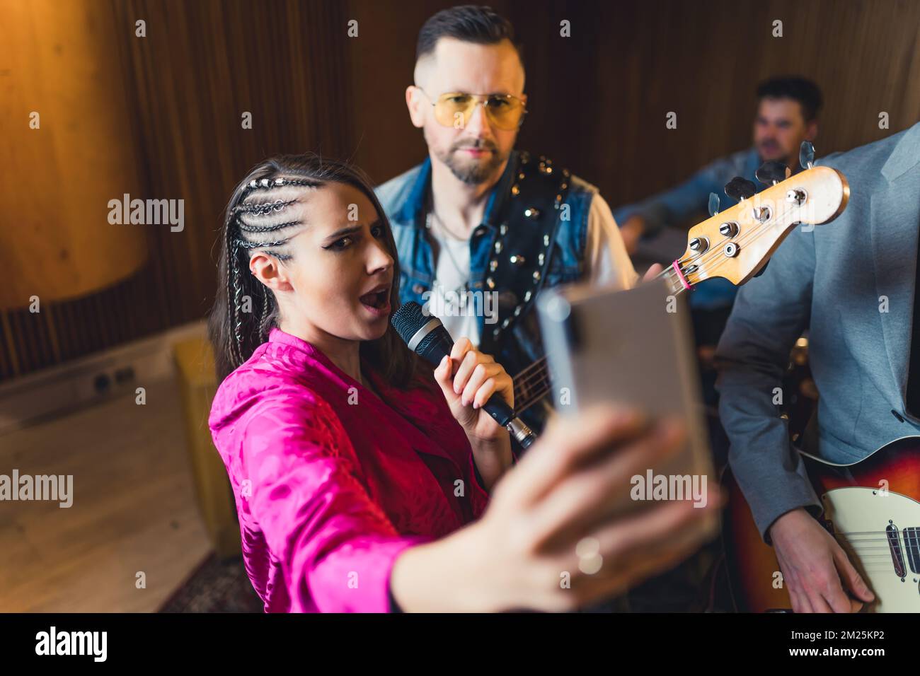 let's show everybody how our repetition is going, music band playing on repetition and recording live video at the same time. High quality photo Stock Photo