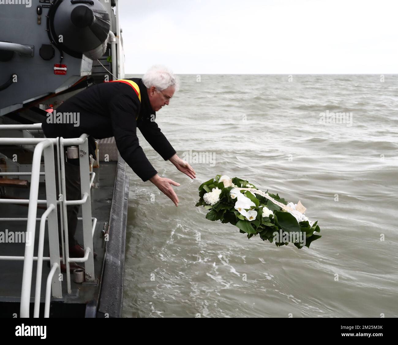 West-Flanders province governor Carl Decaluwe throws a wreath (flowers) to the sea at a ceremony for the 30th anniversary of the Herald of Free Enterprise ferry disaster, on Monday 06 March 2017 in Zeebrugge. On 6 March 1987 the ferry left the harbor of Zeebrugge, bound for Dover with more than 450 passengers and 80 crew members on board. It capsized just outside the harbor. The disaster, which was caused by the failure to close the bow doors, cost the life of 194 people. BELGA PHOTO KURT DESPLENTER  Stock Photo