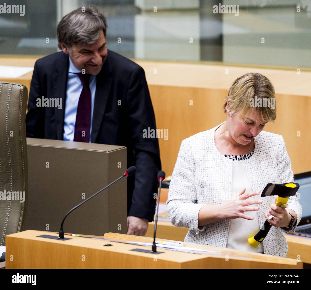 NV-A's Wilfried Vandaele and Flemish Minister of Environment, Spatial Planning and Agriculture Joke Schauvliege pictured after receiving an axe during a plenary session of the Flemish Parliament in Brussels, Wednesday 22 March 2017. BELGA PHOTO JASPER JACOBS Stock Photo