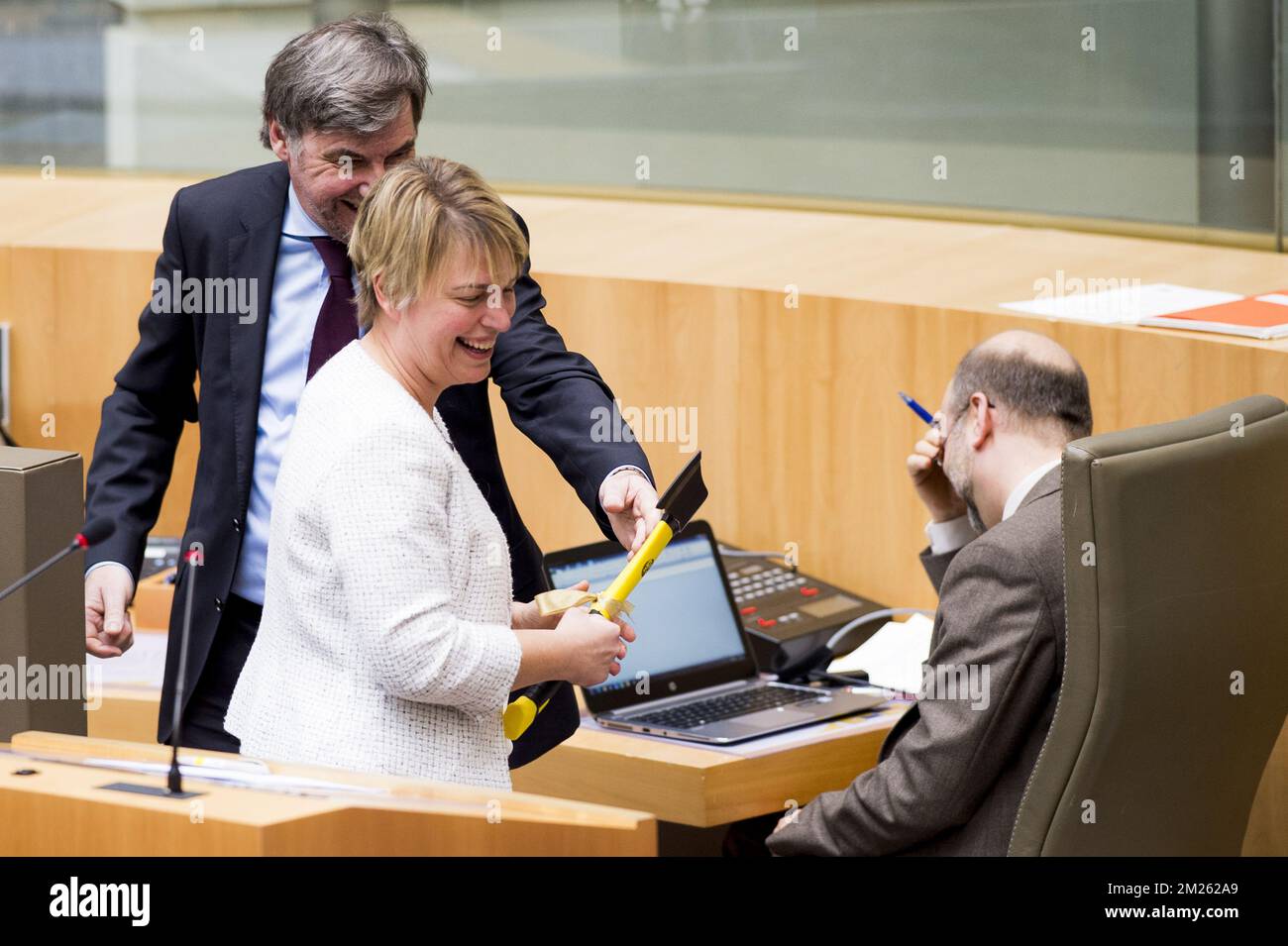 NV-A's Wilfried Vandaele and Flemish Minister of Environment, Spatial Planning and Agriculture Joke Schauvliege pictured after receiving an axe during a plenary session of the Flemish Parliament in Brussels, Wednesday 22 March 2017. BELGA PHOTO JASPER JACOBS Stock Photo