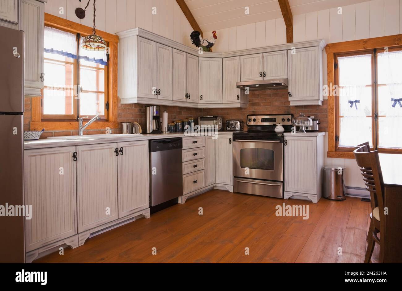 Bleached wooden in kitchen with reddish brown stained