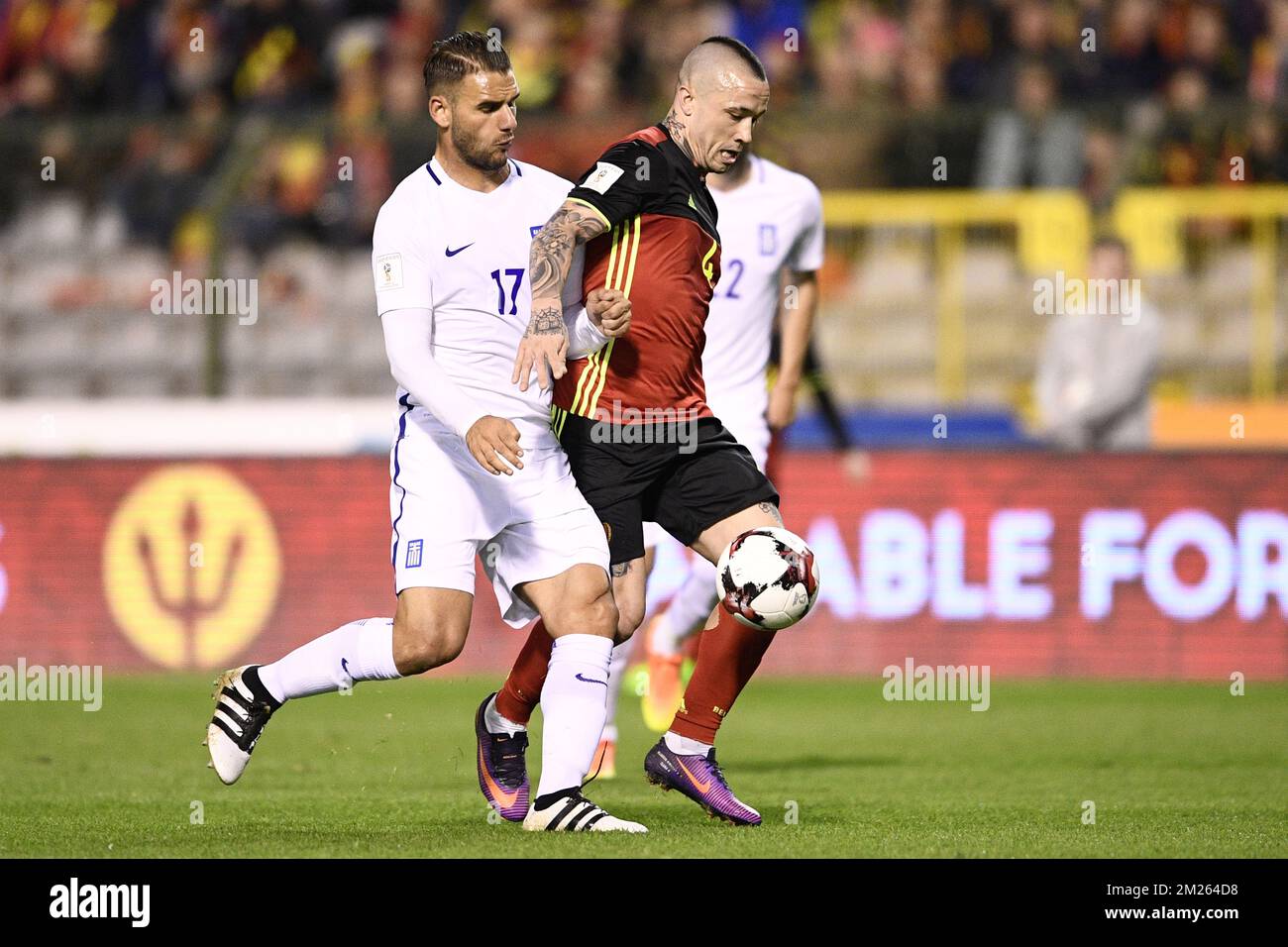 Greece's Panagiotis Tachtsidis and Belgium's Radja Nainggolan fight for the ball during a World Cup 2018 qualification game between Belgium's Red Devils and Greece, Saturday 25 March 2017, at the King Baudouin stadium in Brussels. BELGA PHOTO YORICK JANSENS Stock Photo