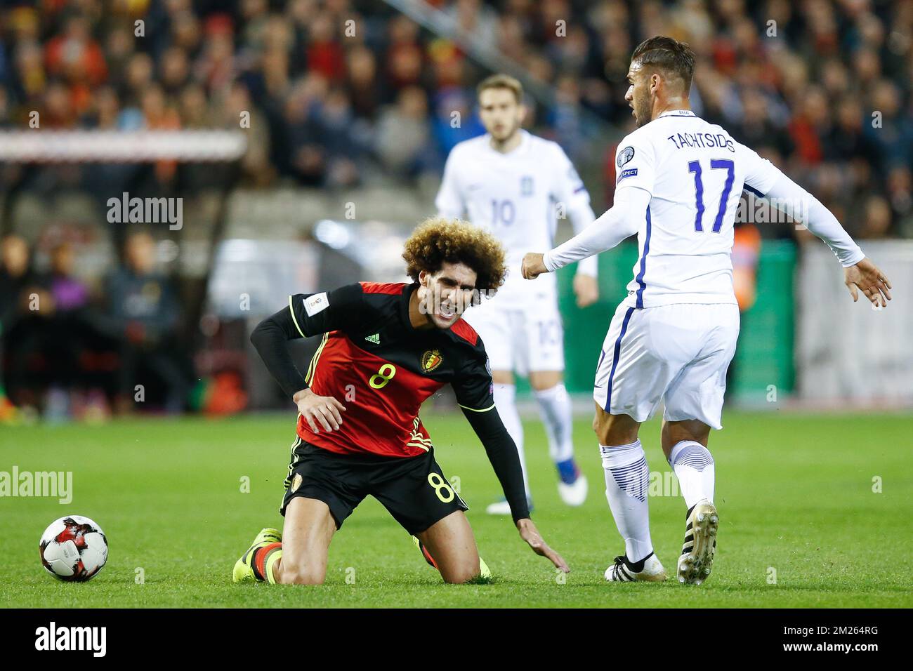 Belgium's Marouane Fellaini and Greece's Panagiotis Tachtsidis fight for the ball during a World Cup 2018 qualification game between Belgium's Red Devils and Greece, Saturday 25 March 2017, at the King Baudouin stadium in Brussels. BELGA PHOTO BRUNO FAHY Stock Photo