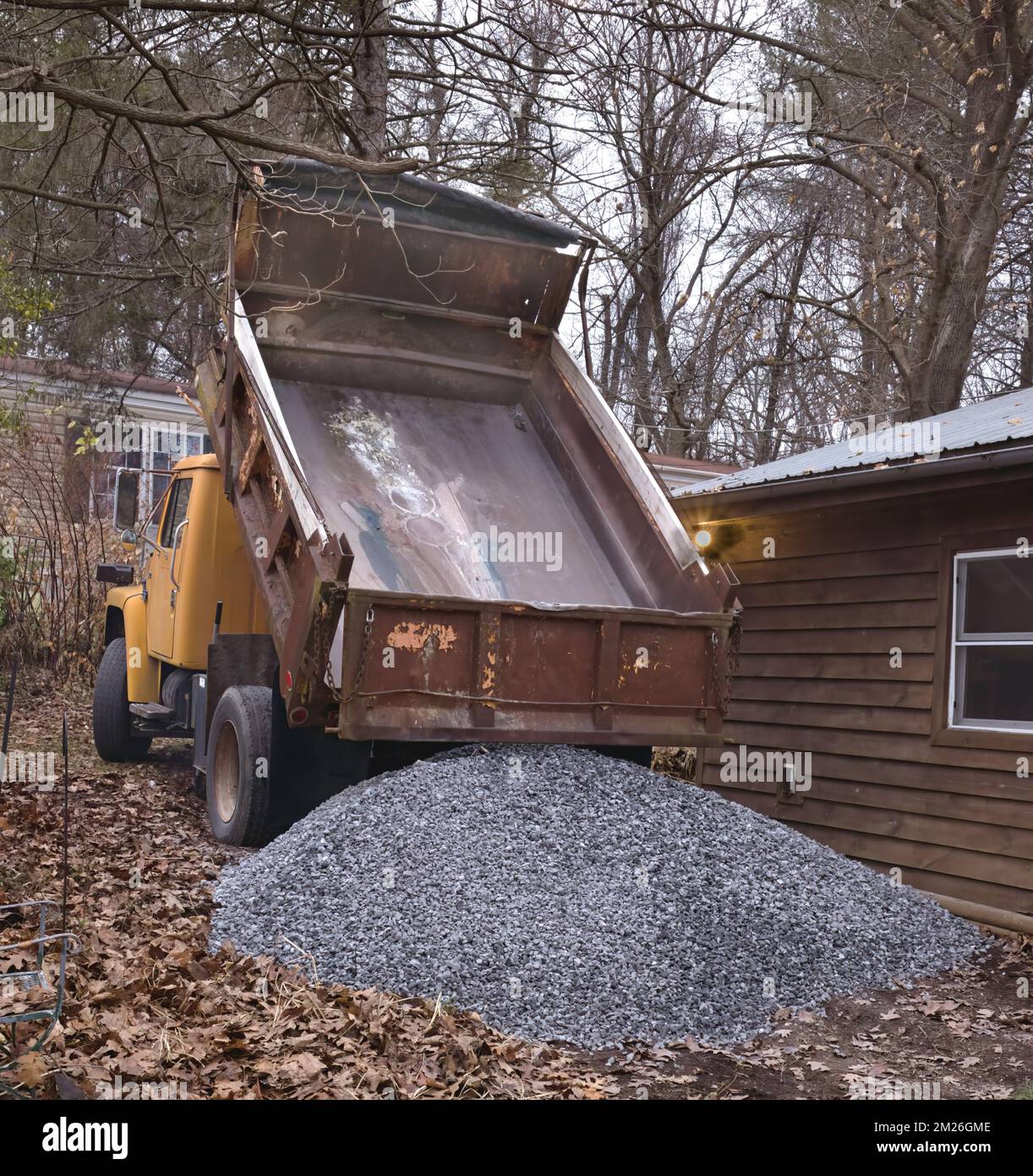 Dump truck dumping gravel at home Stock Photo Alamy