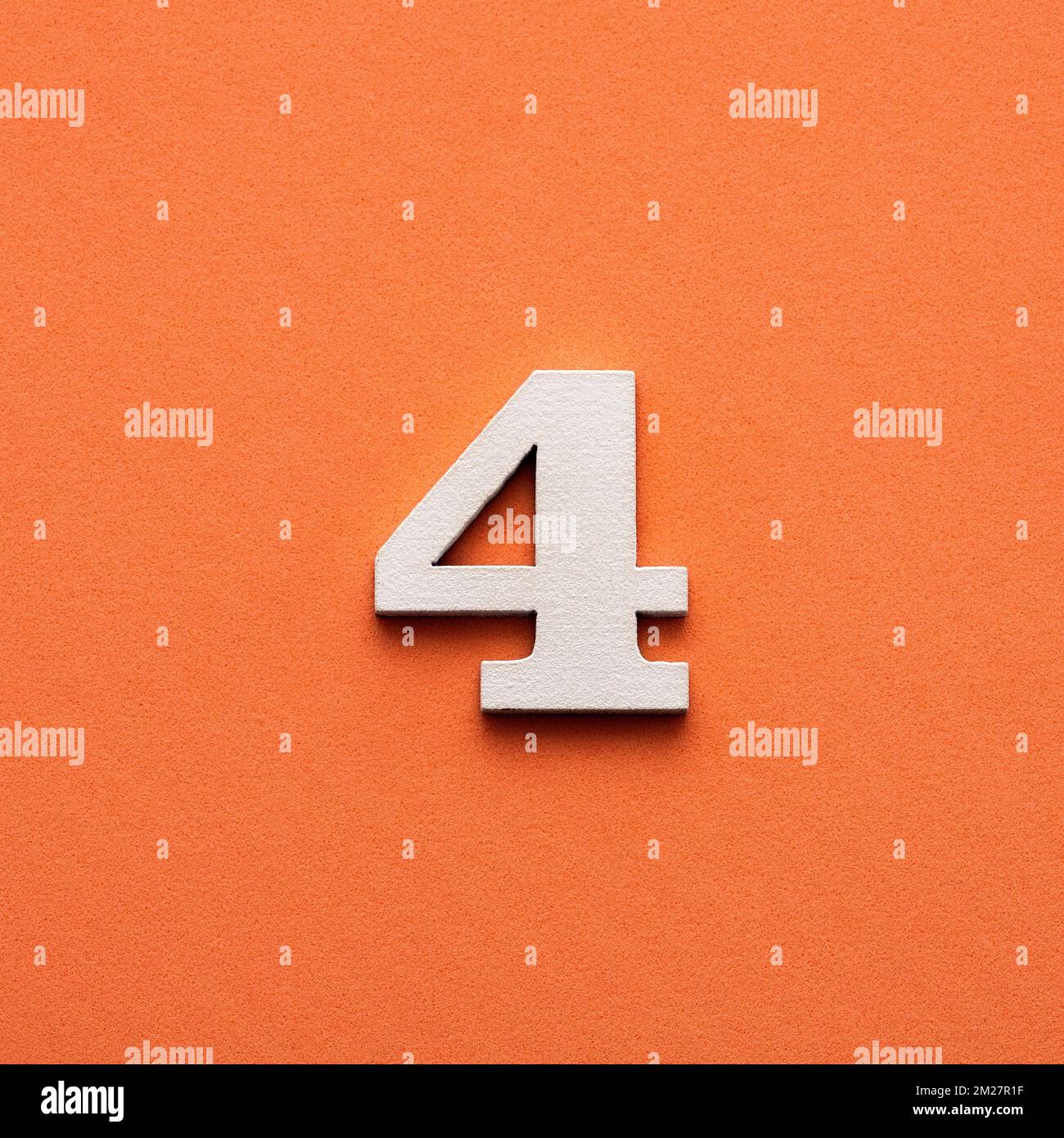 Number four white number in wood on pink background Stock Photo Alamy