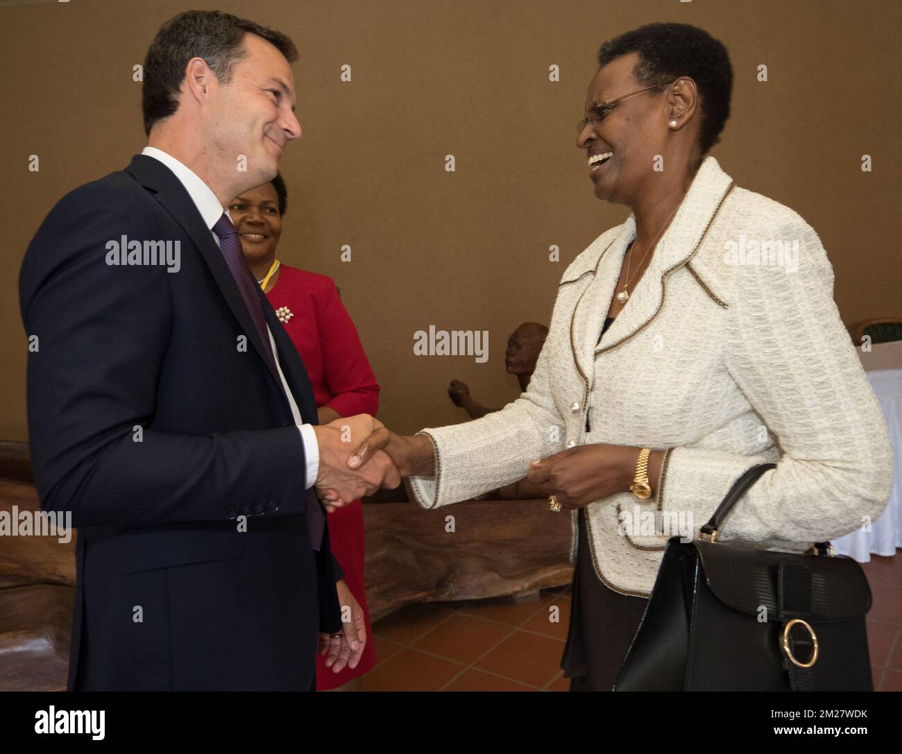 Ugandan President Yoweri Museveni's wife Janet Museveni meets with Vice-Prime Minister and Minister of Cooperation Development, Digital Agenda, Telecom and Postal services Alexander De Croo during a fundraising summit to help the country deal with nearly a million South Sudanese fleeing war. The summit hopes to raise at least $2 billion (1.8 billion euros) to help tackle the world's fastest-growing refugee crisis triggered by continuing civil war in South Sudan. BELGA PHOTO BENOIT DOPPAGNE Stock Photo