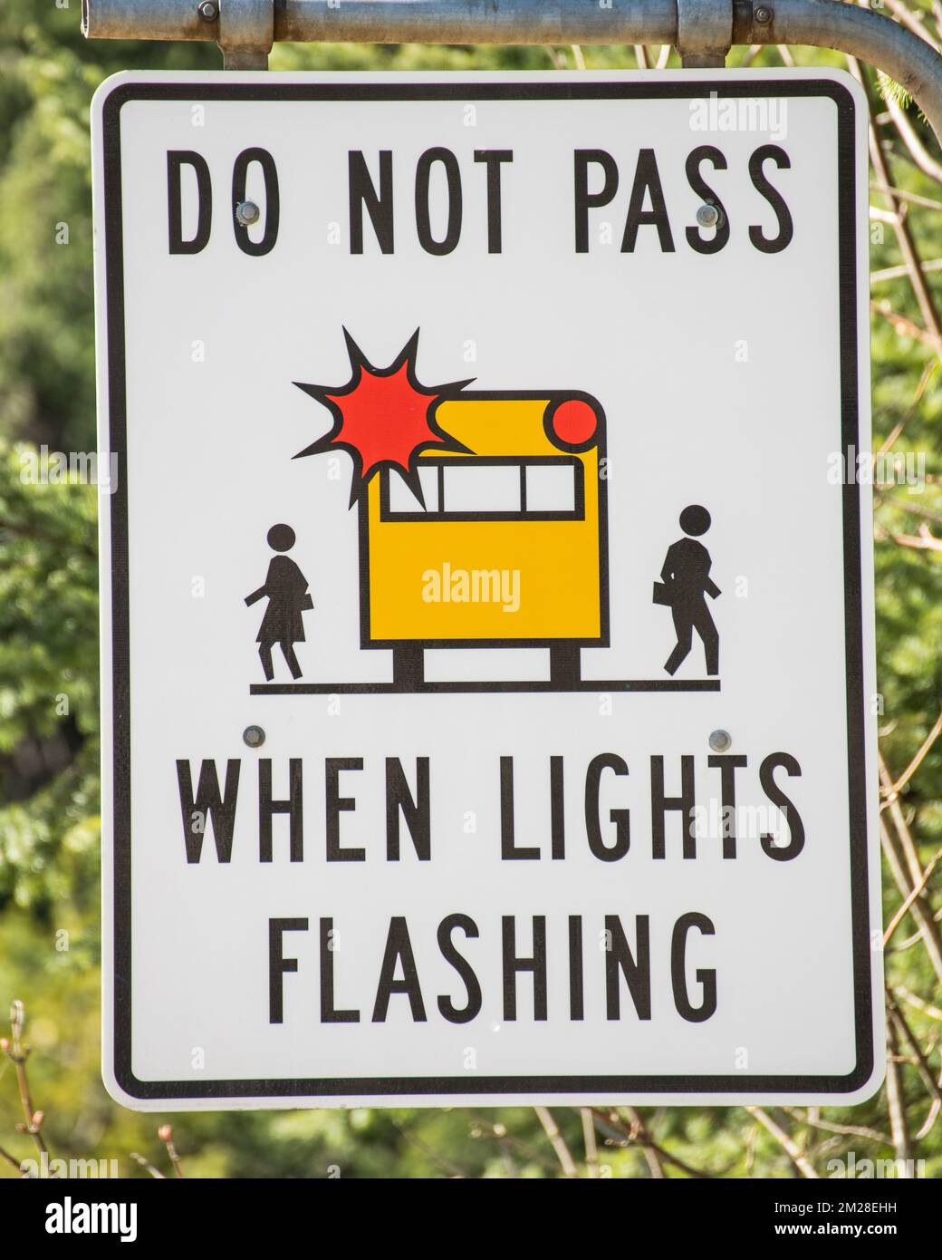 Do not pass school bus sign at the highway junction in Hope, British Columbia, Canada Stock Photo