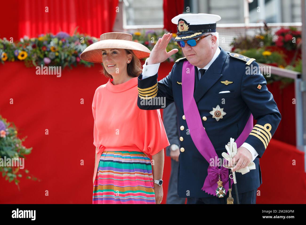 Belgian Prince Laurent (L) is pictured with Princess Claire (R) and her  daughter Princess Louise on the podium during the military parade on the  occasion of Belgium?s National Day in Brussels, Belgium