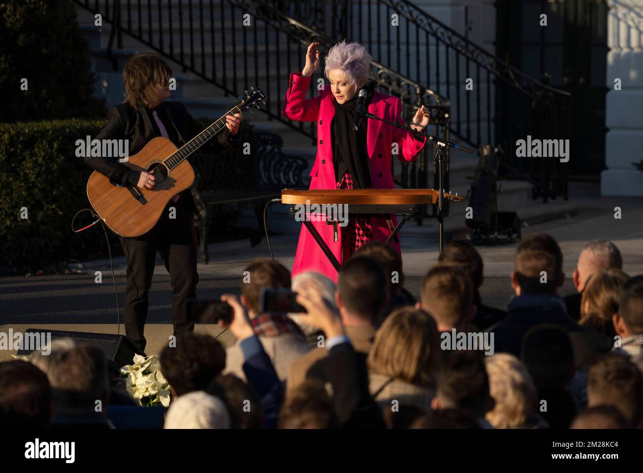 Singer Cyndi Lauper and guitarist Alex Nolan perform in a ceremony with US President Joe Biden to sign the Respect for Marriage Act on the South Lawn of the White House in Washington, DC on December 13, 2022. Credit: Chris Kleponis/Pool via CNP Stock Photo